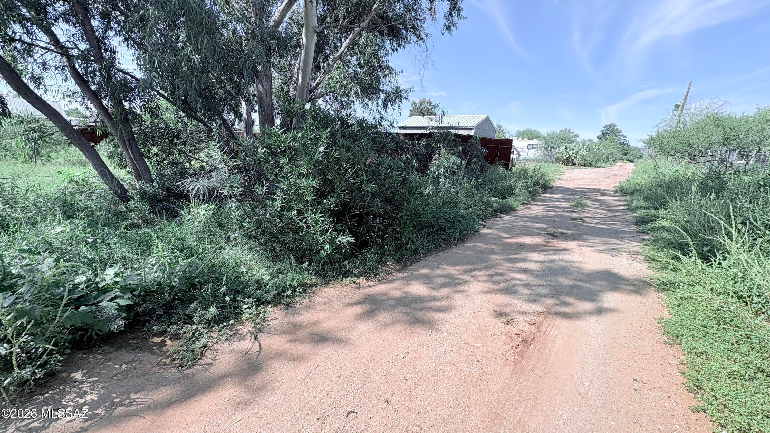 Spacious building lot in Catalina - utilities in area - former site of a mobile - septic ''may'' still be underground. - private, fenced 3 sides.  Neighborhood of site built and manufactured homes.  Quiet area for family living.