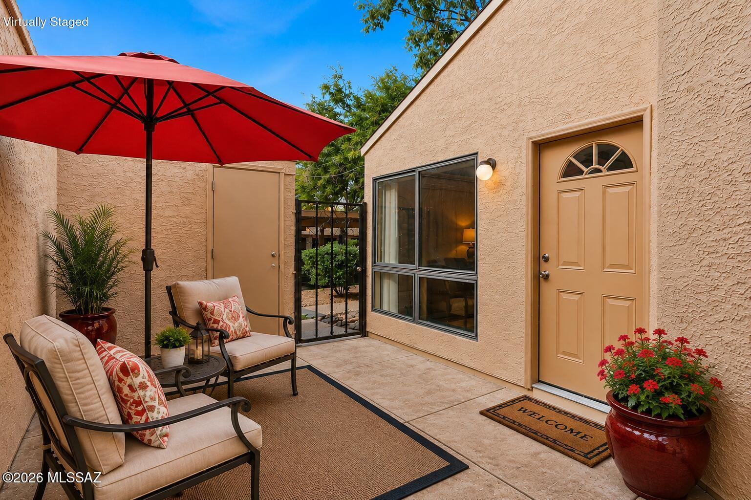 Tucked away in the back of Coronado Place is this contemporary 2BR/2BA condo with a private courtyard entry and covered parking just steps away. Most of the interior has been freshly painted, complemented by all-new modern outlets and switches. Neutral finishes, consistent flooring, high ceilings and a new picture window bring in plenty of natural light. Updated kitchen with breakfast bar, newer appliances & cabinets. Spacious primary bedroom offers a walk-in closet,  second bedroom opens to the patio and has great closet space. Responsive HOA covers water, trash, termites, pool, exterior paint and roof!  Washer and Dryer  convey. Conveniently located near Udall Park, Sabino Canyon, Mt. Lemmon, dining and shopping. Great for students, seasonal living, vacation rental or full-time living.