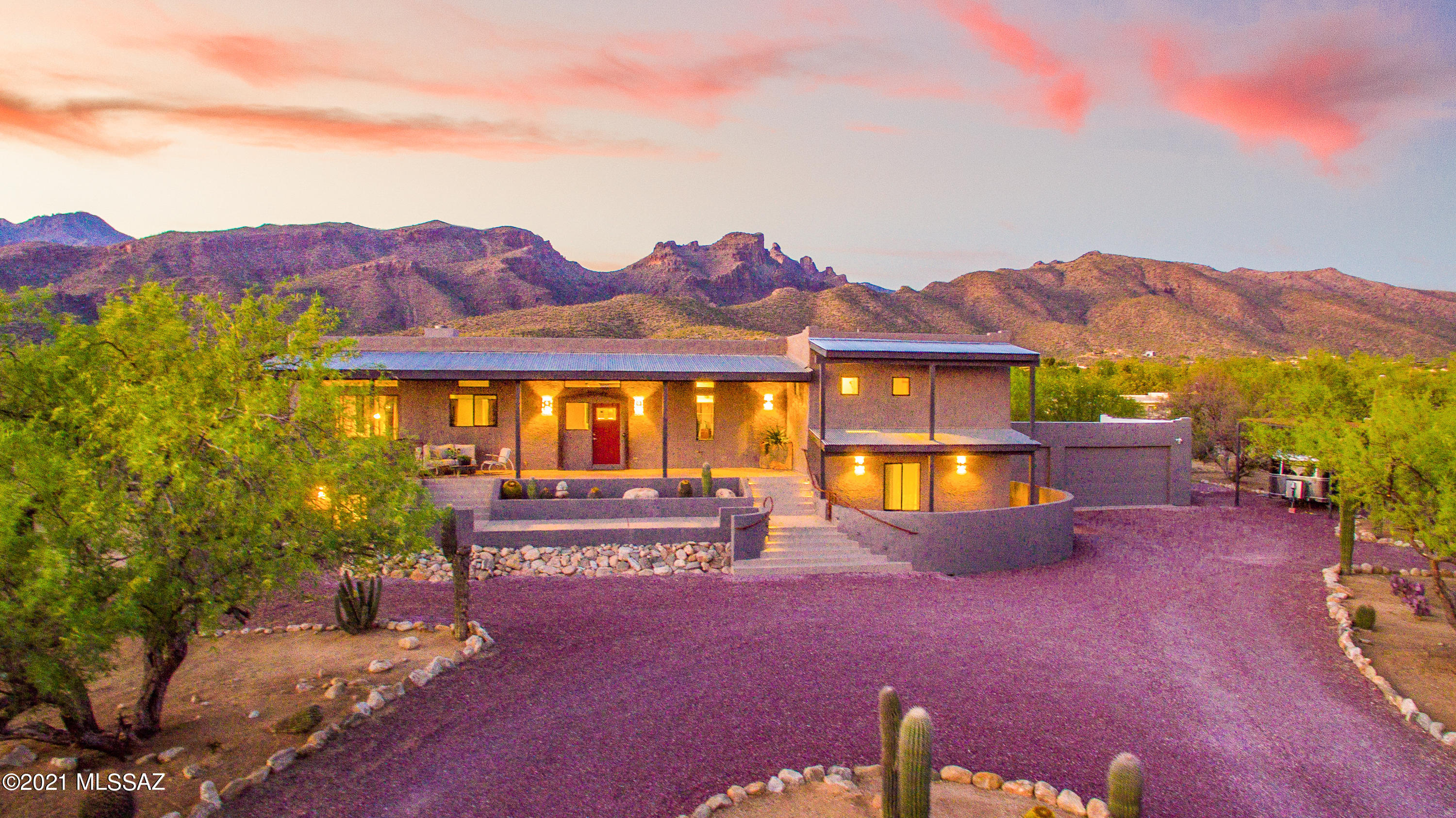 This sanctuary just shy of 2acres with panoramic mountain views is just 3miles from convenient amenities.A modern desert retreat located at the base of the Catalinas with immediate access to a protected nature preserve and hiking trails to the internationally recognized Sabino Canyon.The modern architecture simultaneously provides a level of sophistication and relaxation both inside and out.Every room you find yourself swept away in the beauty of thoughtfully placed windows optimizing natural light and the beauty of the desert.This home offers expansive areas to entertain,includes covered RV parking/elec. hookup, and zoned for horses.Whether you are relaxing poolside, designing in the art studio, or enjoying the secluded guest quarters, you are sure to find limitless possibilities.