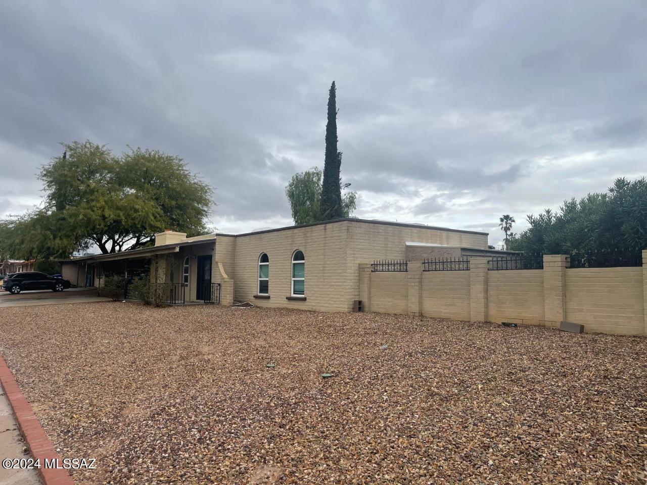 Newly renovated 1800 sq. ft. three bedroom two bath house on quarter acre lot! Huge open concept living room/dining. Large remodeled kitchen with tons of cabinets and upgraded appliances, granite and quartzite counters, skylights, laundry room, wood look tile floors with carpet in the bedrooms, fireplace, glass doors lead to walled/screened in porch. Large back yard with gas fire pit, gazebo, large planter box for gardening if you like, 10 x 20 storage shed, trees, pomegranate tree, paved walkways, and sliding back gate to park or unload into shed. Large driveway for multiple cars. Covered front walkway with iron railings and beautiful glass decorative front door with side lights. Convenient location! Pets welcome. Owner is licensed Real Estate Broker in Arizona. Real Estate Direct, Inc. Walk to Sonoran Science Academy Elementary. Also near shopping and restaurants.