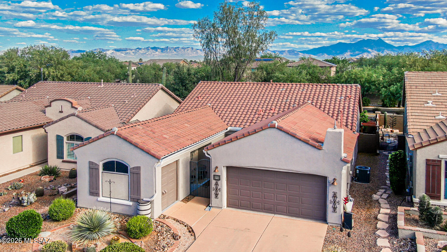 Stunning updated home in desirable Sonora at Rancho Sahuarita, an exceptional age-restricted community w/ its own clubhouse & athletic facilities.  This 3BR/2BA home features an ideal open-concept floor plan filled w/ natural light and beautiful tile & wood flooring throughout most of the home. The kitchen offers granite countertops, a stylish tile backsplash, & newer stainless-steel appliances. The spacious primary suite includes a bay window alcove, dual sinks, large shower, & walk-in closet. Guest bedroom & bath are thoughtfully separated for privacy, while the third bedroom is perfect for an office or guests. Updated golf cart garage features added flooring & its own AC, ideal for storage, flex, or workspace. Enjoy a beautiful backyard w/ covered patio, pavers, fire pit, & irrigation. You will have access to a variety of amenities, including the Del Webb clubhouse with a library, fitness center, pool, spa, pickleball and tennis courts. Further enjoy the amenities of Rancho Sahuarita, including it's beautiful lake, walking trails, pools and other activities perfect for family and friends of all ages. Don't miss this ideal home!