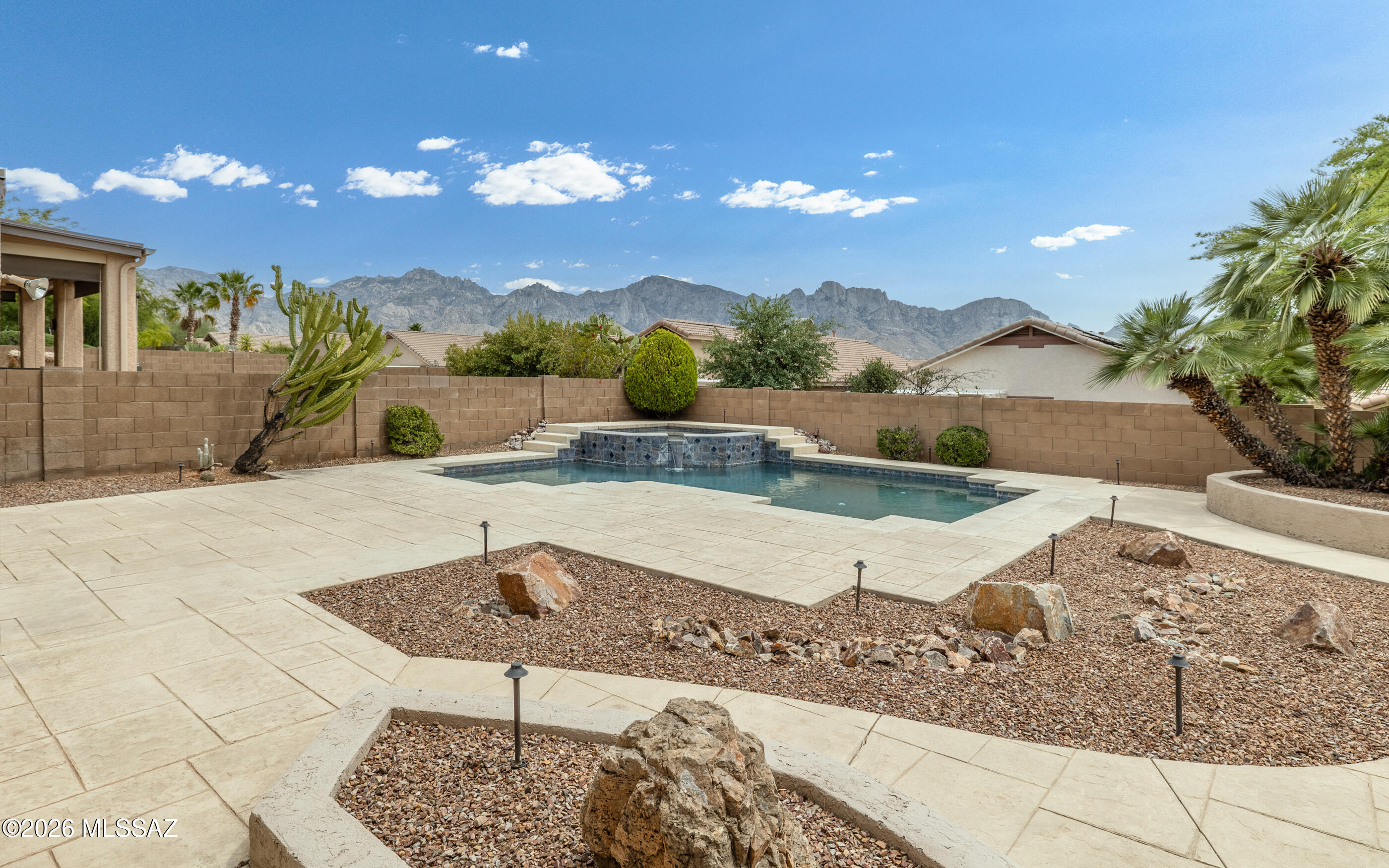5BR/3BA, 3Car Garage home w/2891sqft built on a Premium lot w/ desirable mountain views of Pusch Ridge & Santa Catalina Mountains. This hand-selected homesite, offers superior views,
increased privacy, and designed for the family with traditional formal dining, gourmet kitchen, and dedicated spaces for entertainment. Custom POOL & Spa with fountain feature is surrounded by a Professionally landscaped backyard and stamped concrete decking, exotic cacti
& palms and low voltage lighting. MANY interior upgrades-Plantation Shutters, SS Appliances, RO Water Purification System under Kitchen Sink, Soft Water System, Crown Molding, decorator touches throughout & More. Ask for Features & Amenities information.