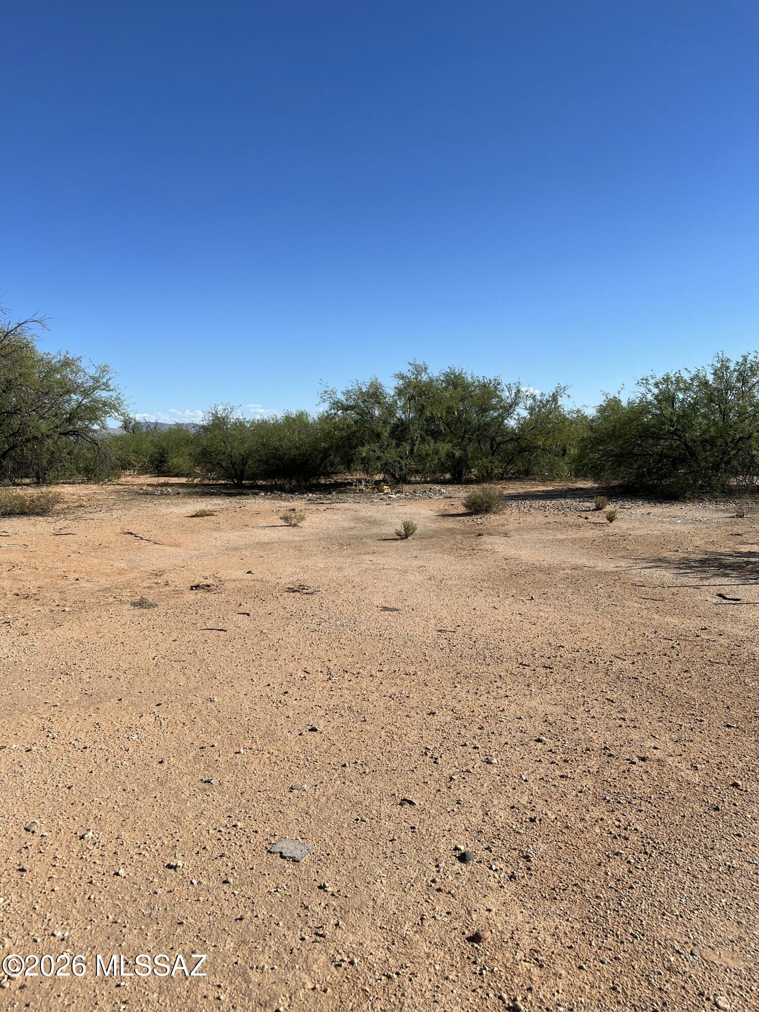 Nice flat lot ready for a manufactured home or new construction. Utilities are in place, water is from a shared well with only 5 user and $35 a month. Power and septic in place. Old manufactured home is now removed.