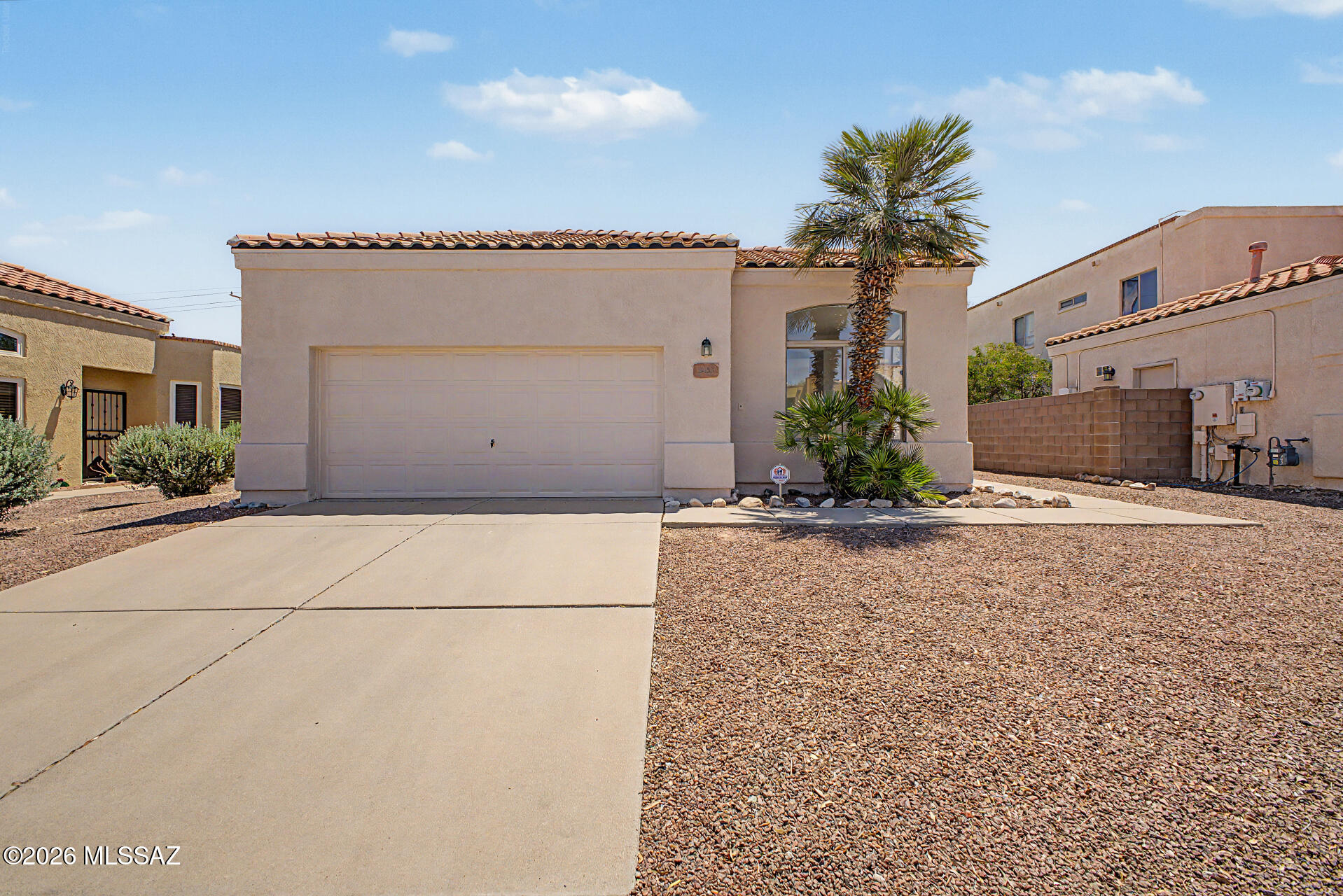 Steel Frame and Brick in Garage! Top quality. This 3-bedroom, 2-bath home with a 2-car garage offers a functional layout with multiple living spaces, solid 8'' stucco construction, and plenty of natural light. Tile and carpet flooring along with ceiling fans throughout create a comfortable feel. The kitchen features ample cabinet space, recessed lighting, and a breakfast bar overlooking the great room with sliding door access to the covered patio. The spacious primary suite includes a walk-in closet and private bath with glass-enclosed shower. Outside, the backyard offers plenty of room to relax, entertain, or customize to fit your needs. Located in the highly sought-after Vail School District and conveniently close to shopping, dining, and more!