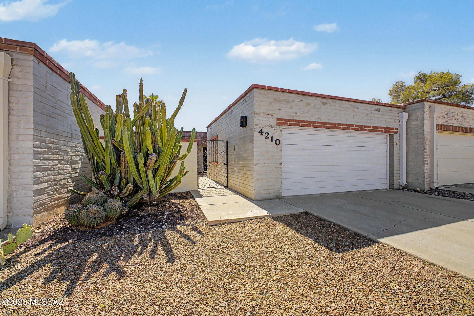 Range-Price $255k-$265k.Seller will Counter or Accept Between the Range. Charming burnt adobe townhome in Limberlost Terrace II with BRAND NEW HVAC! Owner Occupied Community. 2 beds, 2 baths, AZ room, 2 car garage with work bench space, & low care landscape. Gated front entry. Enter to a large open floor plan separate from updated kitchen. Freshly painted, a neutral palette creates an inviting vibe, complemented by NEW carpet in all the right places. The kitchen boasts NEW counters, stained concrete floors built-in appliances & ample white cabinetry. The large main bedroom has two closets & a private bathroom! Second bdrm includes access to the Jack & Jill bthrm. Outback, you have an open patio to unwind & enjoy peace. Enjoy the community pool & spa just walking distance from the home. Other items to note:
Large pantry is in the closet next to the kitchen and garage.  
Washer and dryer and built in cabinets are included.  
Garage is spacious and includes several cabinets and a built in desk/workshop with lighting.  
Kitchen includes newer dishwasher, spacious refrigerator, electric stove/oven , EXTRA counter and cabinet space, & room for a breakfast area.  Fun, creative, & custom cabinet handles in kitchen. 
Baths have unique & custom tile design.
Rolling metal, electric shutters are included to keep out the sun and to lock up the home when you leave town. 
Front entry way has a built in coat closet and stained concrete flooring.  Walking distance from a green park with trees and play equipment for children.  Nearby schools.   
Private, walled-in backyard and front entrance.  
The neighborhood is peaceful and mature. 
In all of Central Tucson this is the only Townhome for sale with a 2 car garage at this price.  Garage includes a workbench space and loads of storage cabinets.