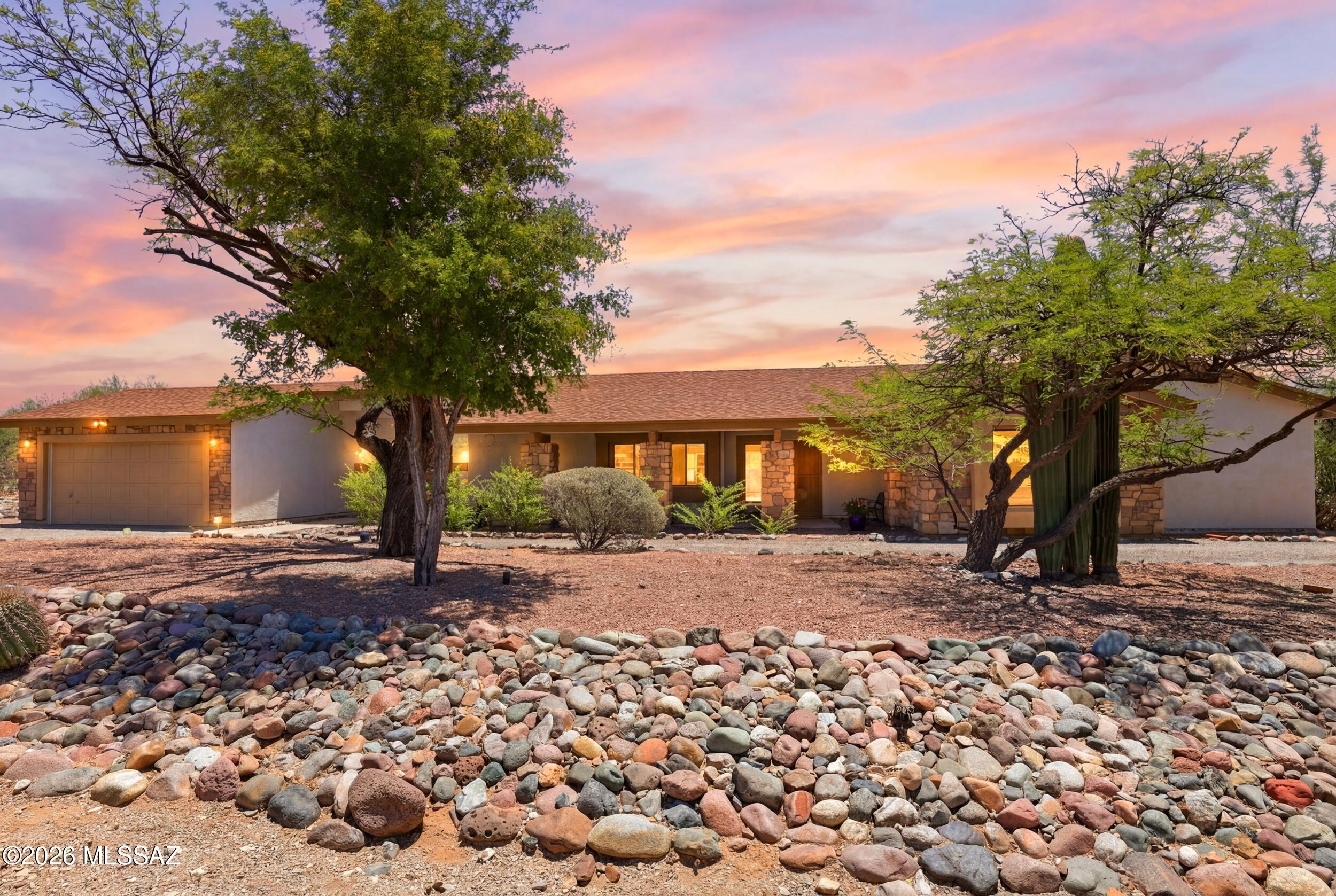 Enjoy peaceful desert living on a spacious private lot with stunning mountain views and mature desert landscaping. This move-in-ready home features vaulted ceilings, abundant natural light, updated flooring, fresh paint, modern fixtures, a cozy fireplace, custom built-ins, a bar, and wine refrigerator. Spacious bedrooms and refreshed bathrooms provide comfort throughout. The backyard offers views of open desert surroundings, a few newly planted trees, and plenty of space to create your ideal outdoor retreat. Enjoy breathtaking sunrises, exceptional stargazing, meteor showers, bird watching, and desert wildlife. RV space is available. Conveniently located near shopping, dining, hiking trails, and everyday amenities.
