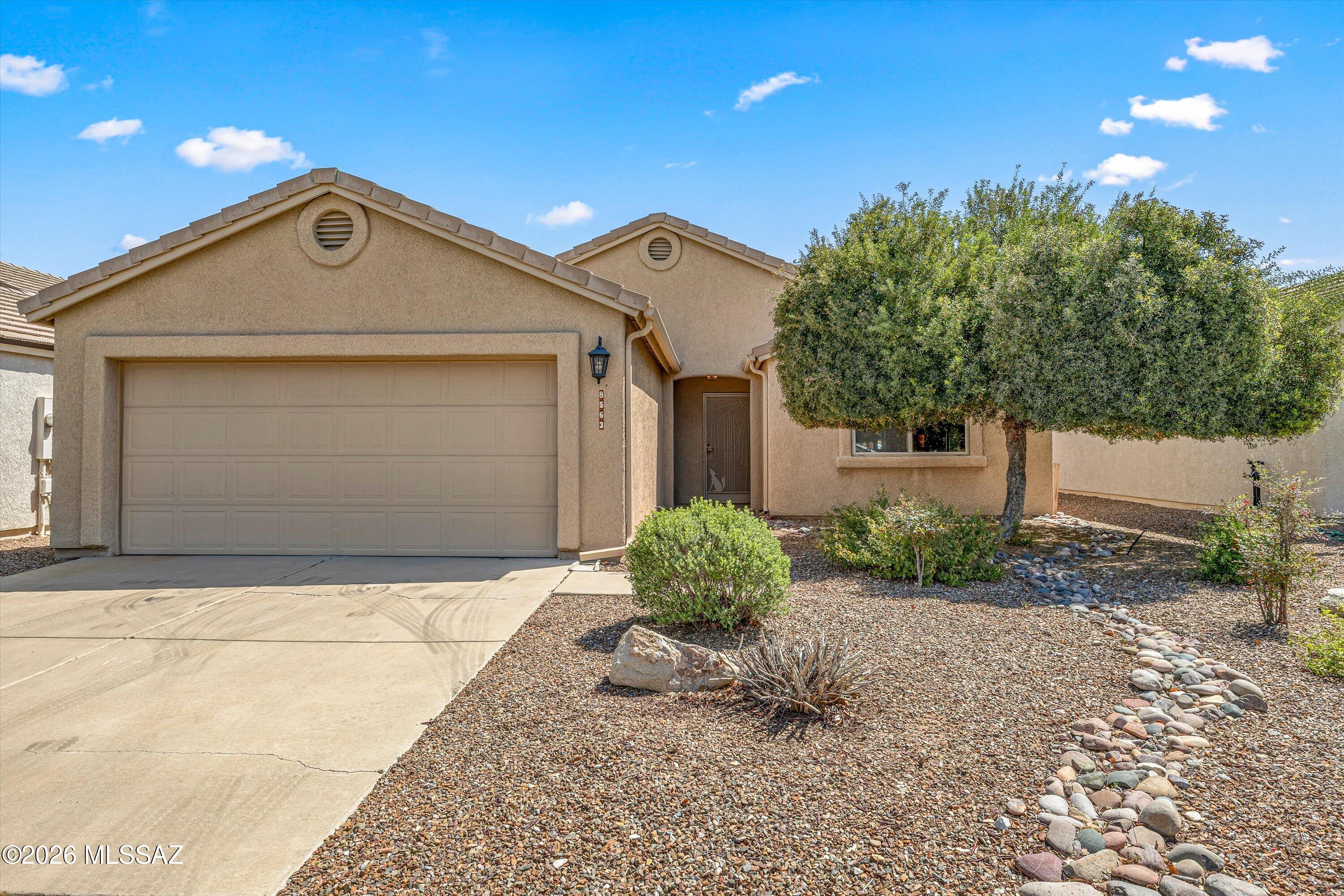 Welcome to easy living in this beautifully maintained 2 bed + den home in a sought-after 55+ gated community! High ceilings and seamless tile flooring create an open feel throughout. The spacious kitchen features pull-out shelving and an abundane of counter space-perfect for entertaining. A versatile den offers space for an office or hobby room, while the second bedroom includes a built-in Murphy bed. The primary has a walk-in closet and updated walk-in shower. Enjoy an indoor laundry room with cabinets, 2-car garage, and low to no maintenance backyard. Newer roof and full home re-pipe complete this lock-and-leave gem!