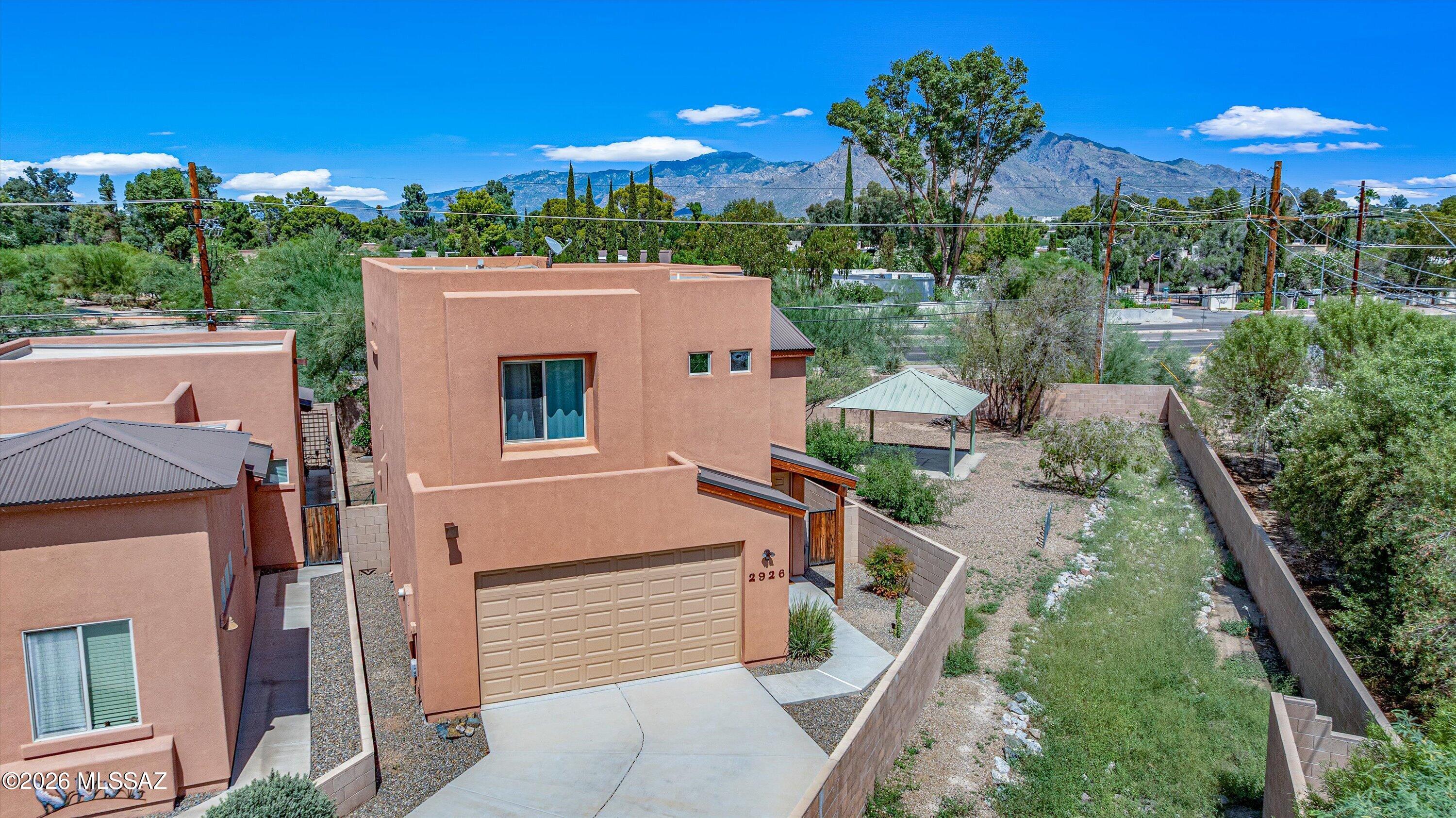 Seller is offering a 2/1 loan buydown. Experience luxury desert living in this spacious corner unit 2015 Miramonte built home. This 4BR/3BA Northwest property is conveniently located near shopping, numerous restaurants, Omni Tucson National and Pima CC and features an open great room layout with high ceilings providing an abundance of natural light, low care backyard with a covered North facing patio, private cul-de-sac / adjacent to HOA common area lot with extended driveway, luxurious kitchen with roomy pantry, granite counters / island, maple cabinets & stainless steel appliances, upstairs laundry room with washer/dryer, mountain views, private primary suite with large walk-in closet, longer lasting synthetic exterior stucco with color mixed in and a Old Republic home warranty plan.