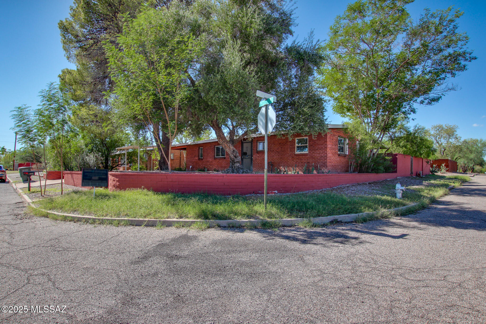 Solid Brick ranch home 1.5miles to UofA!  Secluded neighborhood near Park and Mountain bike path. 
This home has private backyard and an extra large shady corner lot.  Lots of the 'heavy lifting' is done for a midcentury Tucson-style house.  Updated Kitchen and baths. Low E Double pane windows installed 2017. New A/C 2018. New furnace 2020. New tankless water heater 2025. The home was replumbed from the water meter thru-out house in 2011. Electric panel upgrade 2017. Solar. Roof recoated Dec 2025. Newer stove and refrigerator. The backyard has huge covered patio &  tons of extra space, along w/double gate for access to allow for extra vehicles, trailers, etc. NO HOA.  Close to U of A, Banner Medical, Salpointe High, and minutes to Downtown