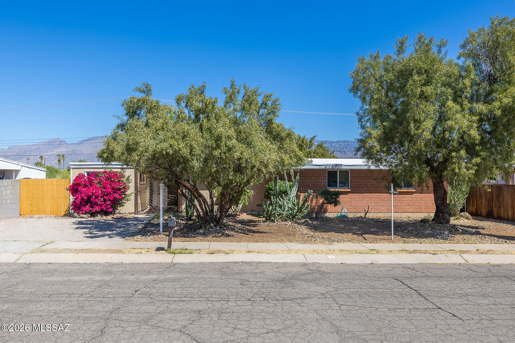 Rare opportunity in one east side's  ideal locations! Near a quiet cul-de-sac, this beautifully updated 4BR/2BA home captures stunning views & offers the perfect blend of comfort, convenience, and charm. The remodeled kitchen is designed to impress with new cabinetry, a center island, ss refrigerator, flooring and abundant workspace for cooking and gathering. A brand-new HVAC system installed in January 2026 adds peace of mind and energy efficiency.  Inviting family room w/ French doors + sidelights that bring in natural light and connect seamlessly to the outdoor setting.  Ideal north/south exposure -backyard faces the Catalina mtns.  Pool-size lot w/ room for growing, relaxing , entertaining.  Starbucks, Sprout, & In-N-Out Burger are walking distance away.  Dreams can come true!