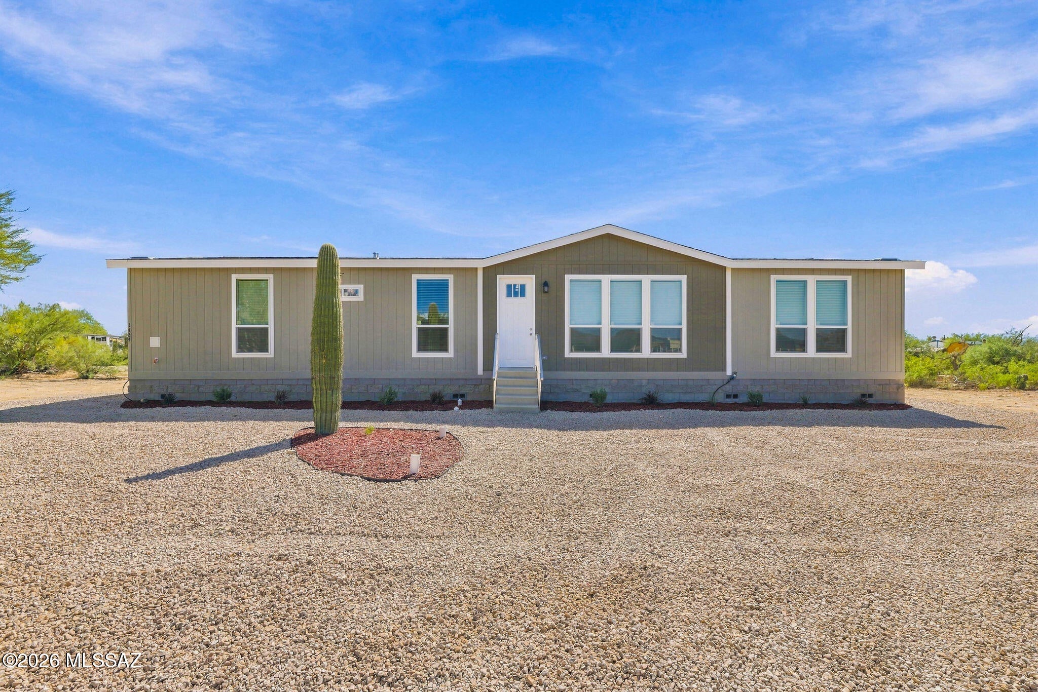 BRAND NEW 2026 CAVCO HOME ON A FULL ACRE! Discover the perfect blend of modern comfort, quality construction, and wide-open space! This beautifully upgraded 4-bedroom, 2-bathroom home features 9-foot ceilings, luxury vinyl flooring throughout, oversized 80-inch windows, and an impressive 8-foot Craftsman front door. The stylish kitchen offers 42-inch upper cabinets, recessed lighting, and stainless steel appliances, including a full-size refrigerator. Enjoy a spacious primary suite with double vanities, ceiling fans and blinds throughout, and an 8-foot sliding glass door. Additional upgrades include a striking 20-foot exterior dormer, custom exterior accent paint, 2x6 exterior wall construction with R-19 insulation, front yard irrigation, and a whole-home fire suppression system. Enjoy the freedom of a full acre with room to make it your own! BONUS: Three additional brand-new neighboring homes are also available! (22624835, 22624832, 22624834). A rare opportunity to choose your favorite home and enjoy the benefits of brand-new construction!