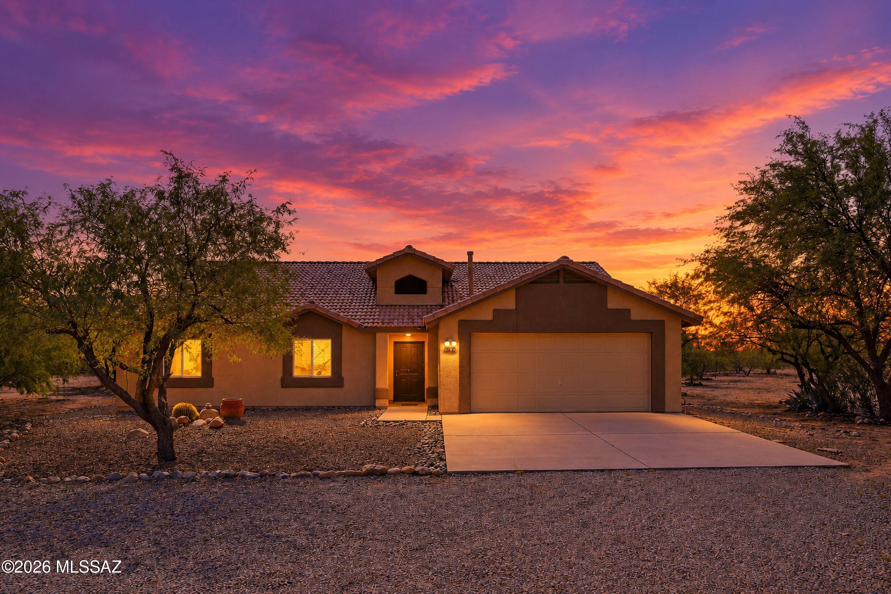 Escape to the freedom of rural living on this stunning 4.13-acre property in Green Valley, where panoramic mountain views and unforgettable Arizona sunsets paint the sky every evening from your own backyard. This fully fenced property features a 2,156-square-foot home, delivering the privacy, space, and breathing room that make Southern Arizona living so coveted -- and with no HOA, the freedom to truly make it your own.

Here, mornings begin with crisp desert air and the silhouette of the Santa Rita Mountains, and evenings wind down on the enclosed patio or under the ramada, watching the sky ignite in shades of gold and pink -- the kind of scenery that reminds you why people fall in love with the desert Southwest. Whether you're entertaining guests or simply enjoying a quiet evening outd