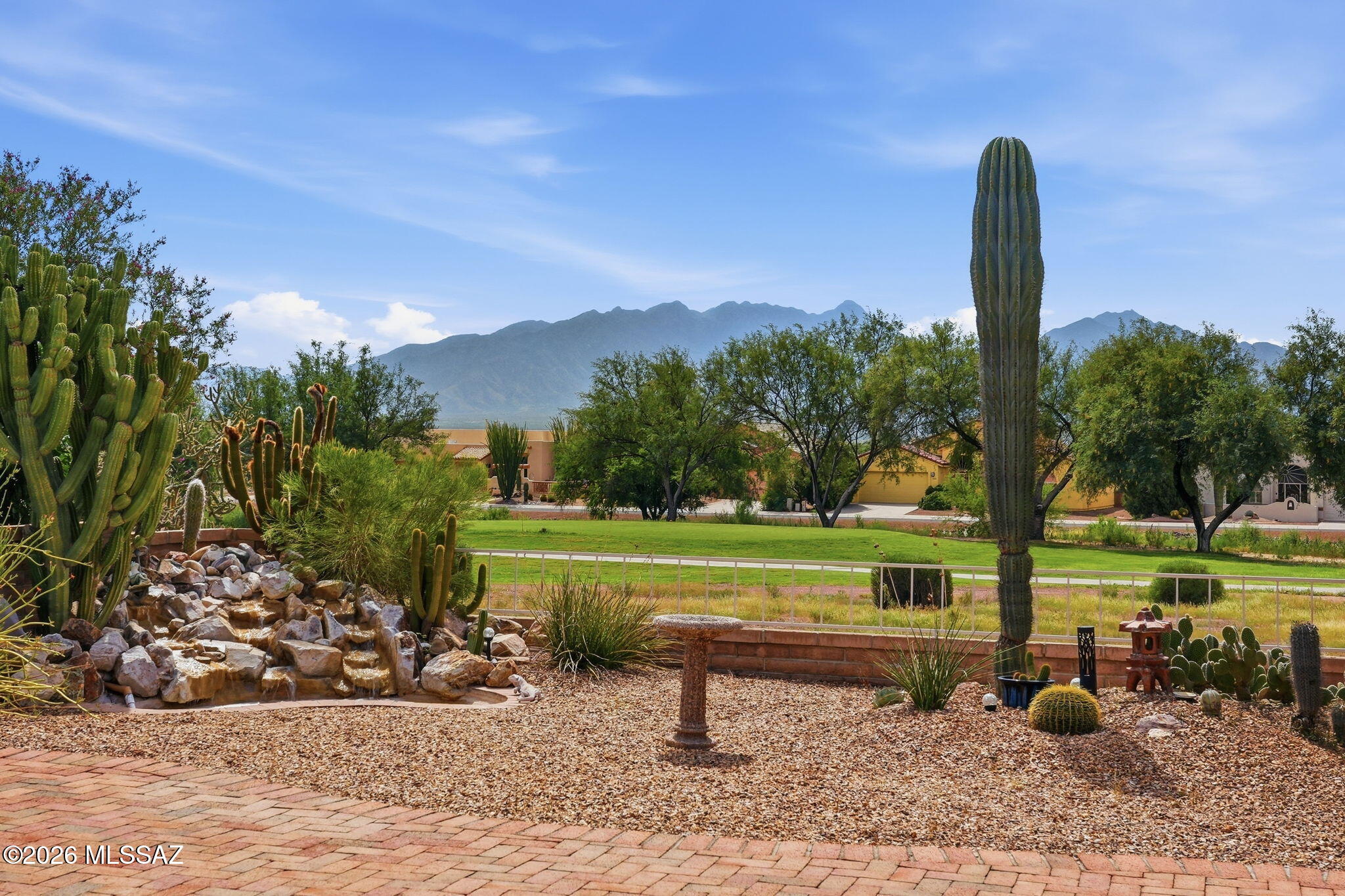 Welcome to The Fairways at Santa Rita Springs! Perfectly positioned along Hole 4 of Torres Blancas Golf Club, this beautifully maintained 2BR + den, 2BA home showcases stunning golf course & Santa Rita Mountain views! An expansive slider wall brings the incredible scenery into the spacious great room. The kitchen features granite counters & upgraded cabinetry, while the primary suite offers separate vanities, jetted tub & tiled walk-in shower. Relax in the beautifully landscaped backyrd with tranquil water feature & breathtaking mountain backdrop. Spacious 2.5-car garage & convenient golf-cart access to the course right beside the home. OWNED SOLAR & EXTENSIVE GVR active-adult amenities with 15 rec centers! Furnishings & golfcart available separately or may negotiated with acceptable offer