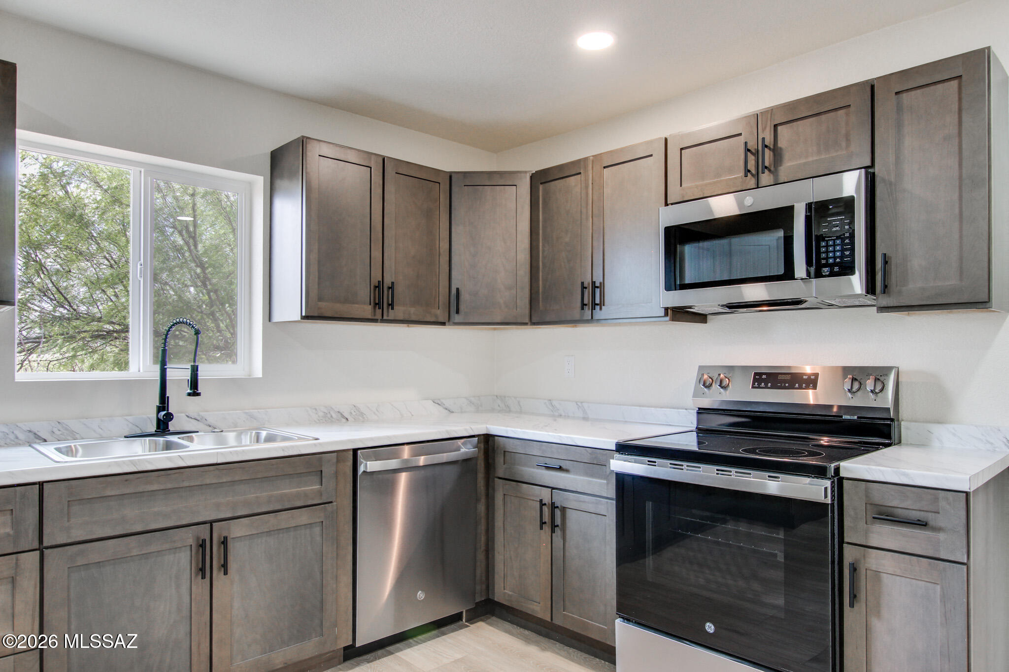 Don't miss this beautifully updated ranch-style home in Bisbee! This move-in-ready property features stylish wood-look plank flooring, plush new carpet, modern electrical and plumbing fixtures, a new roof, new AC system, and new energy-efficient windows. The updated kitchen shines with stainless steel appliances, upgraded countertops, and modern cabinetry. The bathroom has also been tastefully refreshed, creating a clean and inviting space throughout the home. As an added bonus, the sale includes Parcel 102-56-048, providing an additional 0.95 acres of land and expanding the possibilities for this property. This is an exceptional opportunity to own a fully renovated home with extra acreage. Schedule your showing today--this one is a must-see!