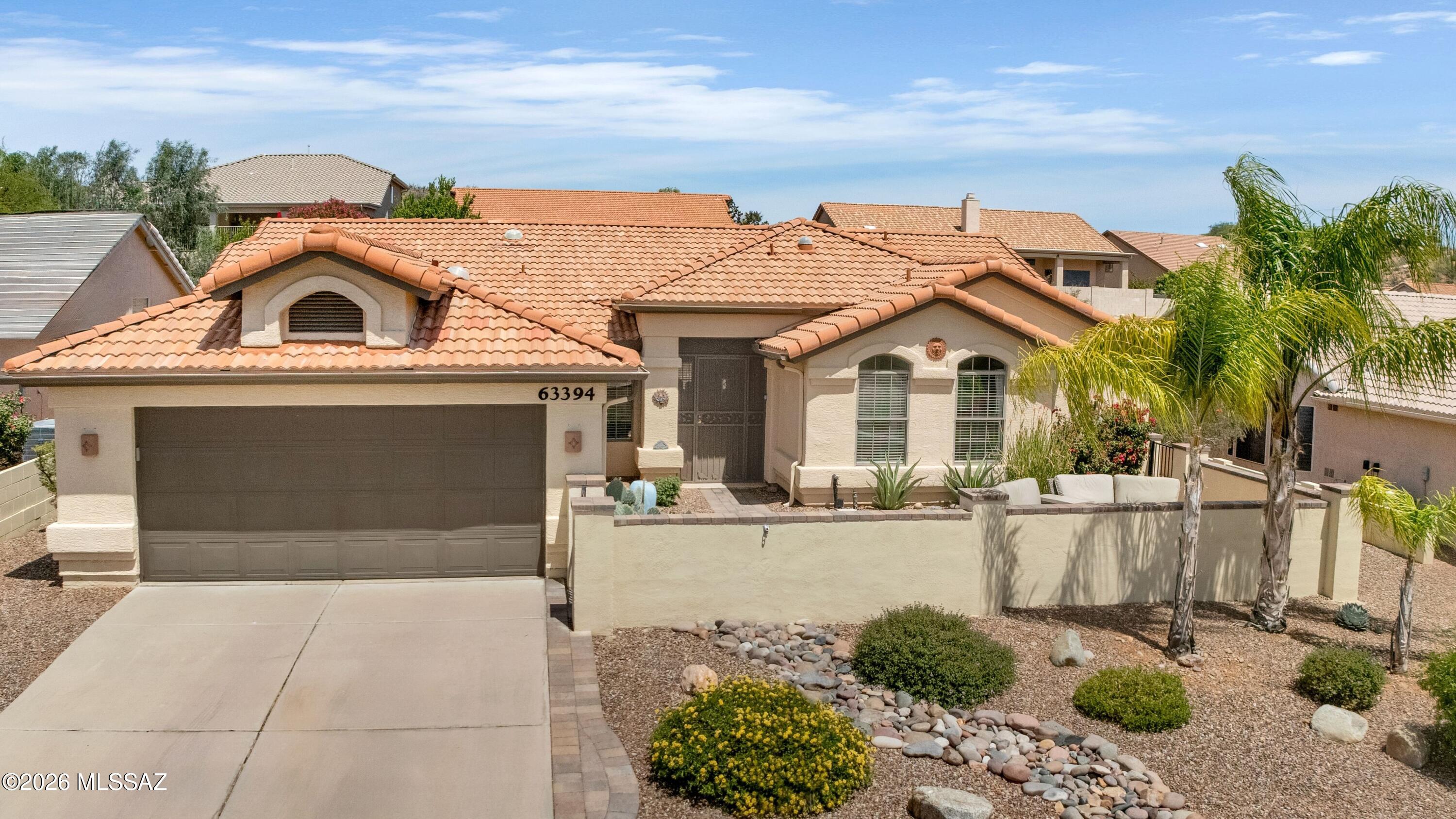 Updated Topaz with Mountain Views from front & backyard! Roof underlayment replaced 4/2026. Gated paver courtyard with fountain welcomes you to this open-concept home. Custom wrought iron entry leads to Great Room & dining area with slider to patio. Kitchen features granite counters, slate appliances, abundant cabinetry, desk, & breakfast nook. Owner's suite offers slider to patio. Ensuite Bath with barn door, granite counters, custom cabinets, walk-in shower, & walk-in closet. Den/Office with French doors. Guest bedroom has walk-in closet & nearby bath with walk-in shower. Tile & luxury vinyl plank flooring thru-out, plus 4 solar tubes. Laundry room with W/D, sink, & cabinets. 2-Car garage with 2017 HVAC, 2024 W/H, & cabinets. Covered patio & extended patio to enjoy mountain views.