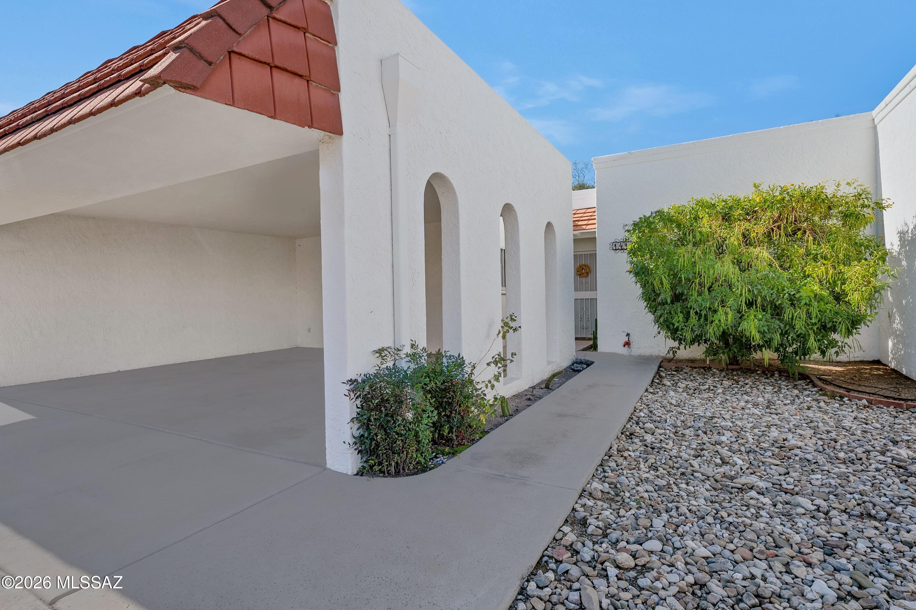 Well-suited for seasonal residents, first-time buyers, or those seeking a low-maintenance full-time home, this 3-bed, 2-bath condo offers comfort, privacy, and convenience. Both bathrooms are spa like and have upgraded spa-shower faucets. The split floor plan allows flexibility and separation, while skylights fill the home with natural light. The in-unit laundry with storage adds everyday ease and convenience. Enjoy extra space in the Arizona room, perfect for hobbies or relaxation, enhanced by an orange and a grapefruit tree just outside the patio door. The rare privacy is a bonus with only one neighboring unit and no neighbors behind, and only steps from the community pool, hot tub, and guest parking. Reasonable HOA fees enhance overall affordability. SOLAR LEASE IS PAID IN FULL Ideally located near shopping, dining, parks, major medical facilities, and the University of Arizona, this home offers an easy Tucson lifestyle in a well-kept community.