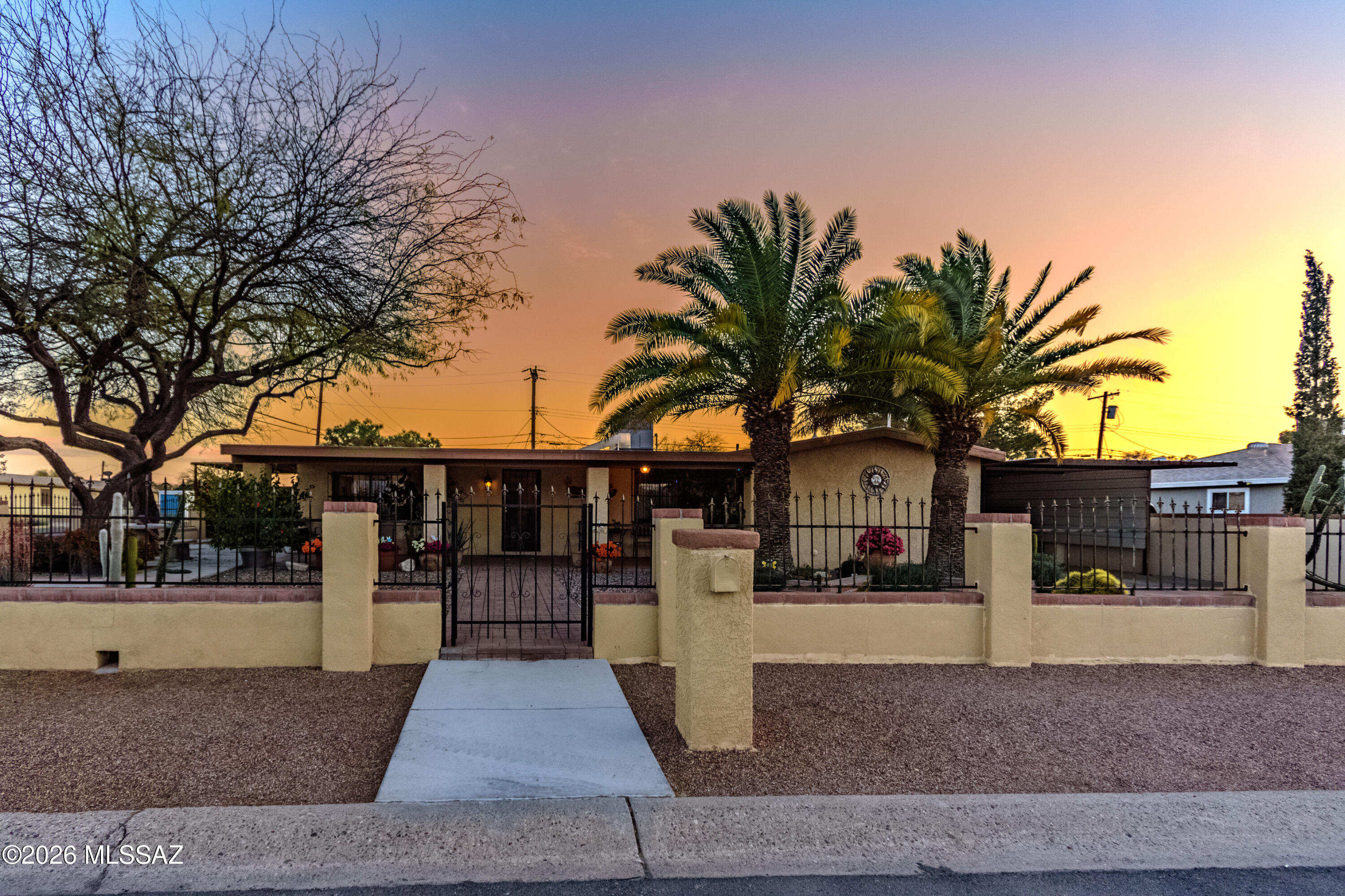 Beautifully remodeled 3-bedroom home with bright open living spaces and modern finishes throughout. The kitchen features granite countertops, stainless appliances, and custom cabinetry that flows into the spacious living area, Tile throughout the home, perfect for entertaining. Mature trees and manicured landscaping create a private backyard retreat, while multiple covered parking spaces and a garage provide rare convenience in this neighborhood. That's 4 covered parking spaces AND an enclosed Garage! Don't miss this gem