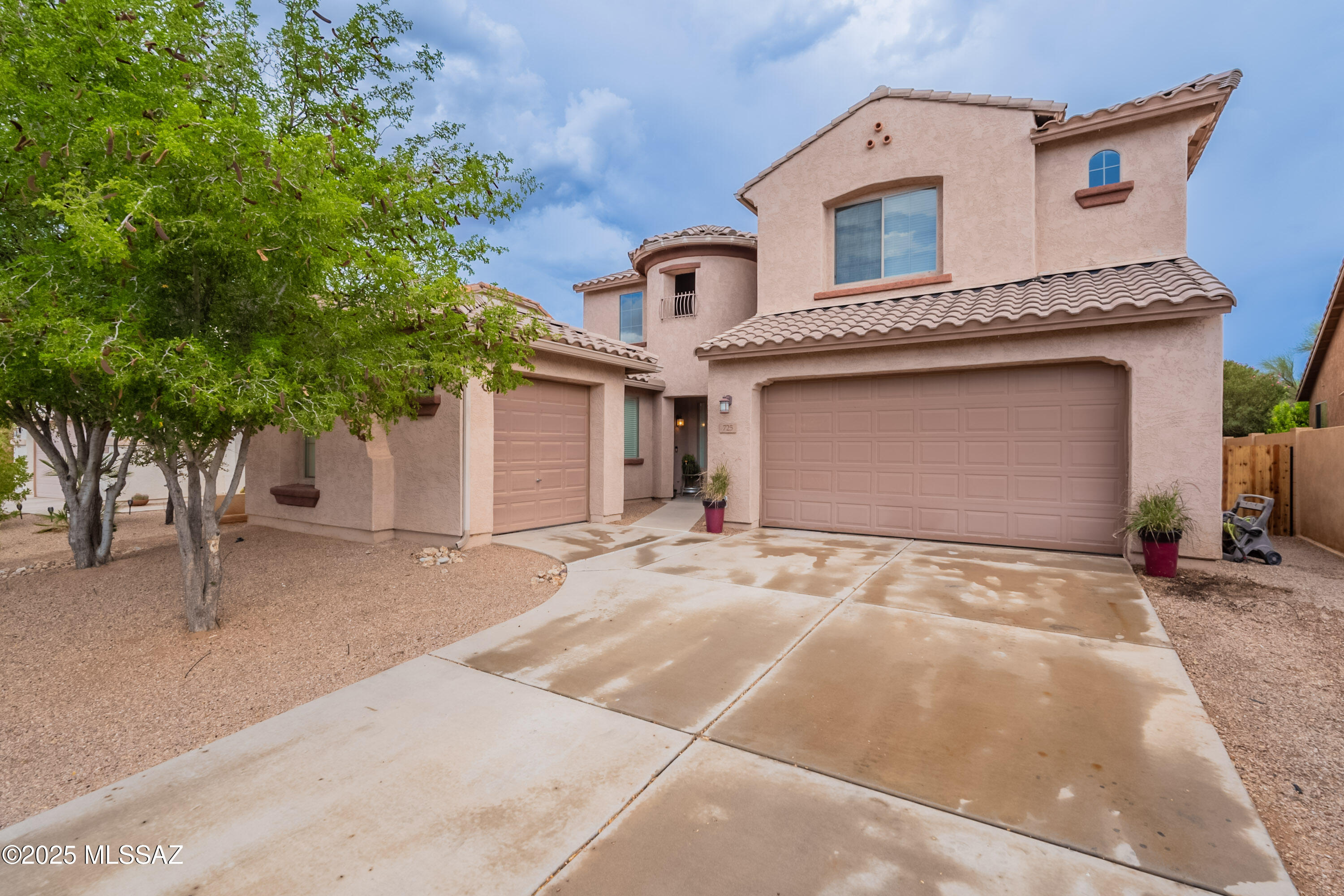 LOCATION is EVERYTHING!!! This BEAUTIFUL and ROOMY 2 story home is LOCATED in the GATED sub division of ENTRADA BONITA in RANCHO SAHUARITA!!! Just MINUTES WALK to ANZA TRAIL SCHOOLS and other COMMUNITY AMENITIES including CLUBHOUSE with WORKOUT CENTER, SAHUARITA LAKE PARK, SAHUARITA BARK PARK, and WALKING AND BIKE TRAILS!!! RESTAURANTS and SHOPPING just minutes away as well. LOOKING for a home with a separate GUEST SUITE and FULL BATH DOWNTAIRS? We've GOT you  COVERED!!! As well as SUBSTANTIAL UPGRADES throughout!!! NEW carpet throughout, A GOURMET KITCHEN that offers EXTENDED 45'' CHERRY CABINETS with CROWN MOLDINGS, GRANITE counter tops, HUGE kitchen ISLAND, DOUBLE OVENS, GAS cook top STOVE, HANGING pot rack, STAINLESS STEEL & BLACK APPLIANCES, WALK IN PANTRY, WINE RFRIGERATOR, Separate FORMAL DINING ROOM, EAT in kitchen, SPACIOUS primary suite, DUAL VANITY, garden tub, separate walk in shower, HUGE walk in closet, UPSTAIRS loft area, GENEROUS sized bedrooms ALL with walk in closets, GORGEOUS private backyard living, NO REAR NEIGHBORS, COVERED patio, PERGOLA, raised PLANTER BEDS, FRUIT TREES, ARTIFICIAL TURF, DOF RUN with DOGGIE door that opens to SECRET inside DOGGIE ROOM!!! DON"T MISS OUT on this EXCEPTIONAL OPPORTUNITY!!!!