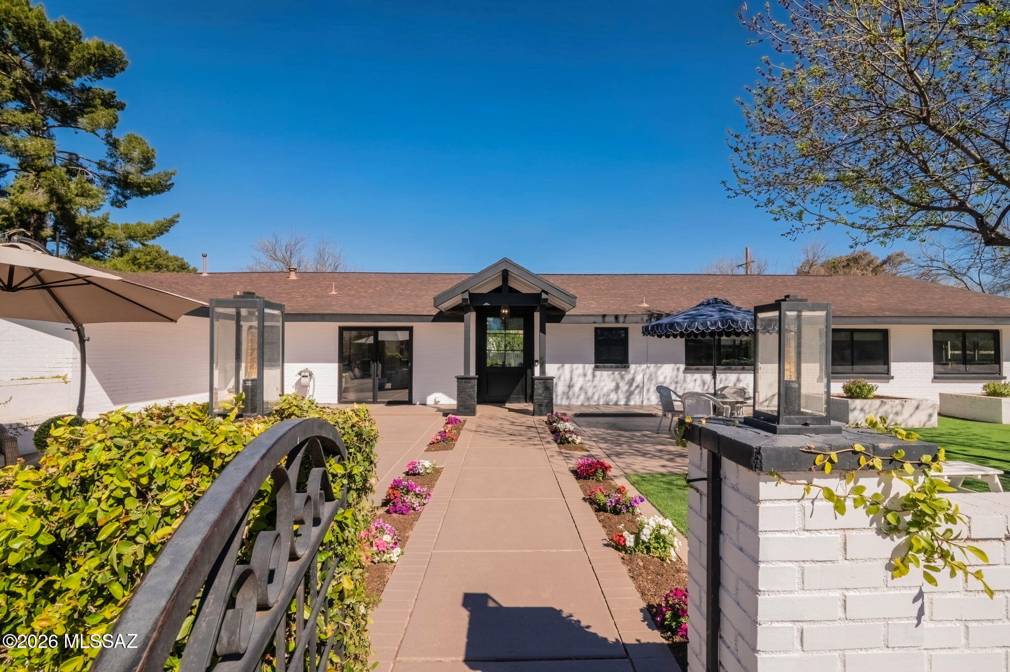 Tucson Country Club Estates lifestyle at its finest! Exquistely Remodeled! 32' expanse of glass wall w/sliding 8' high glass door system captures the Catalina Mountains from the moment you enter!10' hi soaring ceiling w/skylights in Great Rm wash the ambiance w/cheer! Custom built ins thruout including closets & built in bar next to French glass doors leading to front courtyard w/FP. Gorgeous kitchen w/10' quartz island w/waterfall end caps. Wood paneled Subzero Fridge. Hi end La Corneu Gas Range made in France topped w/handmade custom hood. Huge play rm! French Oak engineered wood flooring. 3 car garage fully insulated & heated & cooled. Monument trees shade oversized yard & BBQ. Irrigation on reclaimed water. Pink Bed Crown & drape set do not convey. Outdoor jungle gym does not convey.