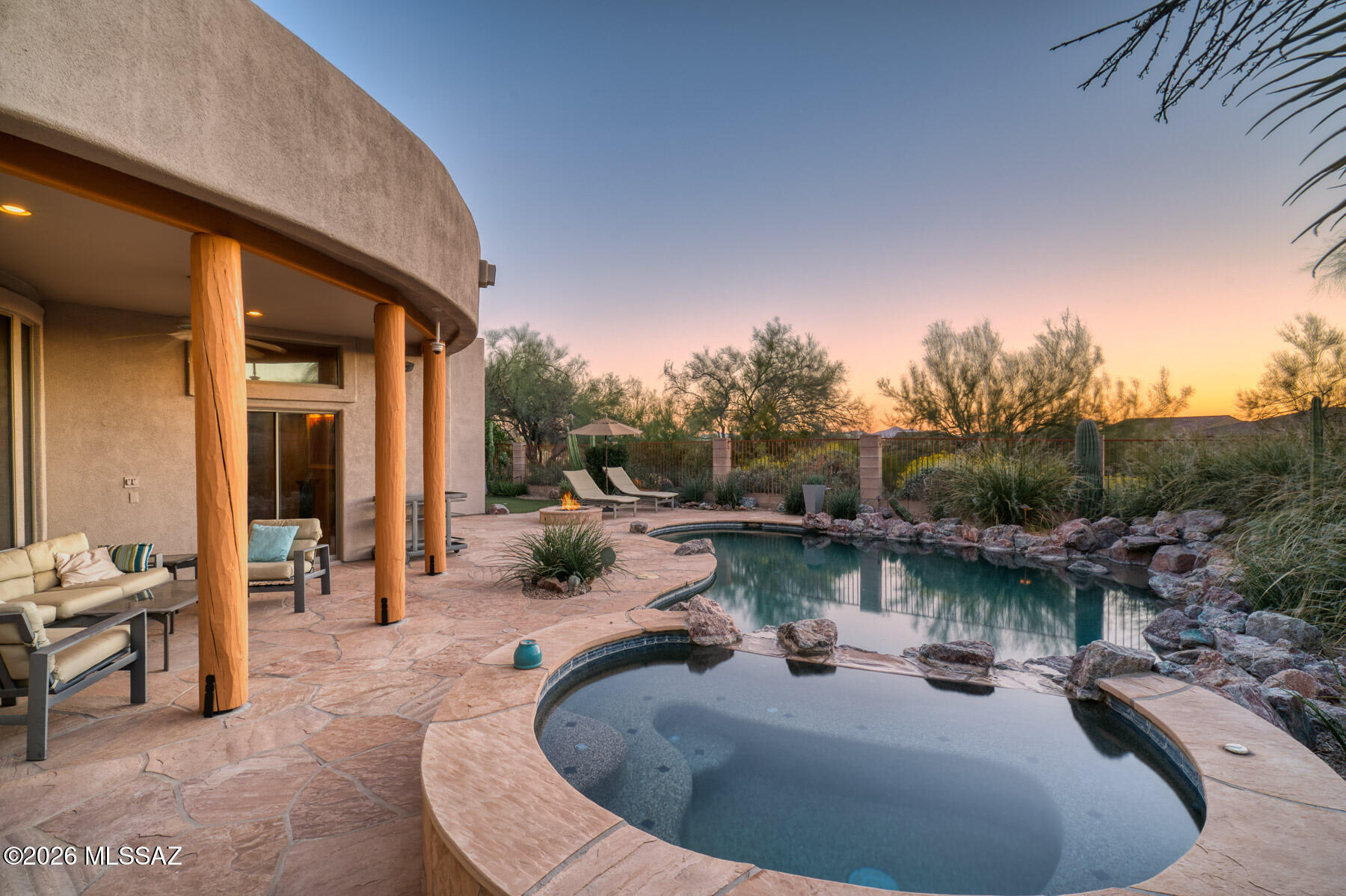 This beautiful  Zen resort-like property currently available after 20 years of Ownership. This second home in coveted Stone Terrace, served as the owners dream Tucson home. Backing up to the scenic Rancho Vistoso Trails Preserve, this gorgeous Lennar-built contemporary home features many upscale upgrades throughout. The residence offers a spacious split floor plan with four bedrooms and three bathrooms, as well as a three car garage. The outdoor space serves as a private oasis, complete with a sparkling PebbleTec pool and waterfall, a putting green, a fire pit, and a key lime tree.