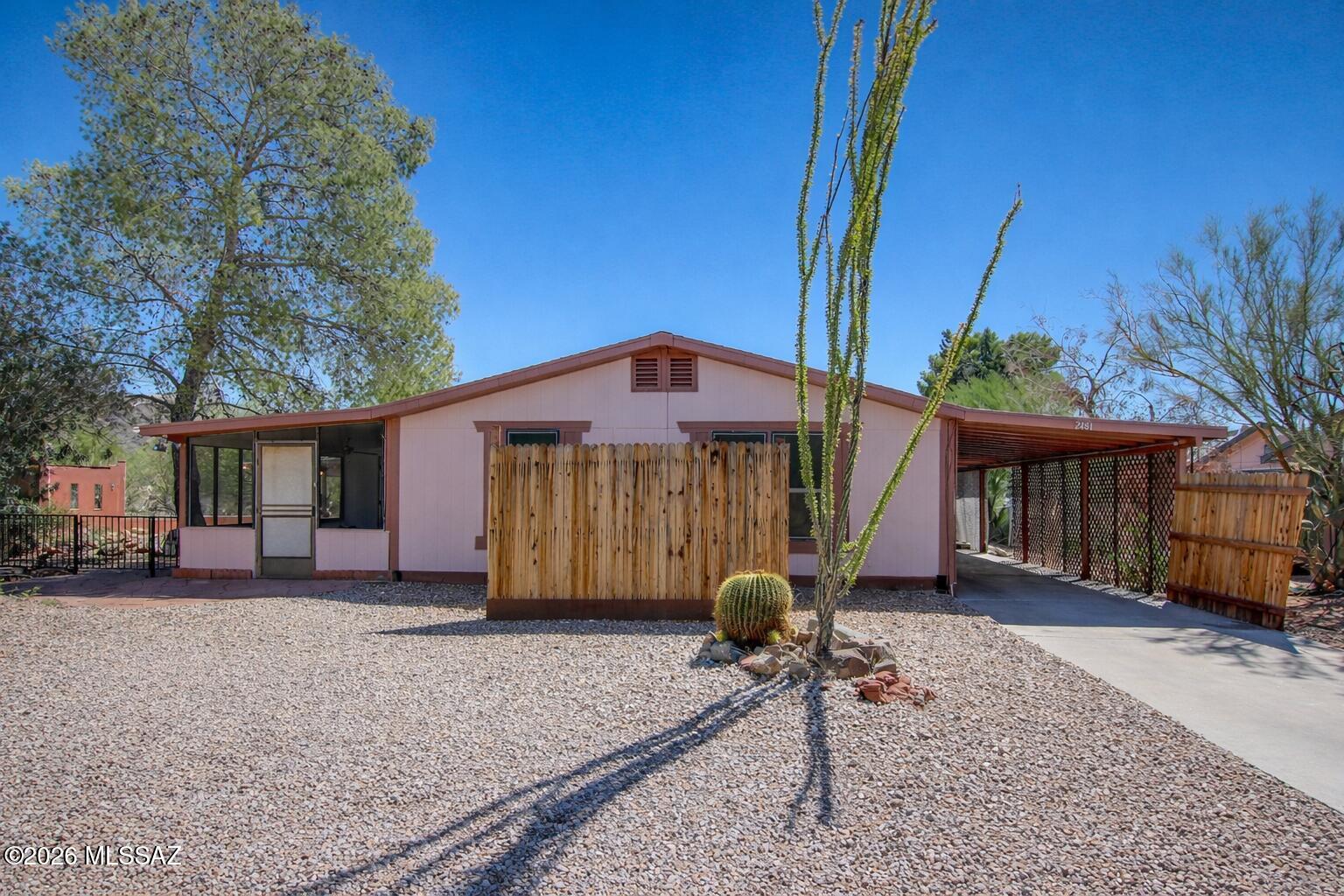 Recently adjusted and priced to move. Golf course home in Tucson Estates No. 2 with sweeping mountain views and exceptional yard space. Located in a gated community that is not age restricted. This 3 bed, 2 bath home offers nearly 1,700 sqft with a bright open layout, vaulted ceilings, fresh interior and exterior paint, new flooring, and updated lighting. The kitchen features new countertops, stove, and dishwasher. Split-bedroom floor plan plus an Arizona Room on HVAC adds flexible living space. Detached workshop with its own electrical panel provides added functionality. Covered patio overlooks the course and mountains. Low HOA with pool, spa, pickleball, tennis, and more. Move-in ready and one of the best values for size in the area.