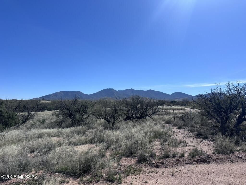 Discover the perfect blend of space, freedom and location with this 12ac vacant land parcel offering breathtaking mountain views and endless possibilities.  The property features a prepared house pad, is fenced and is ready for your custom home vision to come to life.  The property carries Agricultural status, offering potential tax advantages while maintaining flexibility for your rural lifestyle goals. Bring your horses, build your dream shop, create the ranch lifestyle you've been wanting.  This is true horse property with room to roam.  Convenient quick access to I-10 makes commuting to Tucson or Sierra Vista simple while still enjoying the peace and privacy of wide-open spaces. Rare acreage, mountain views no HOA, and prime location.  Don't wait!  Call today!