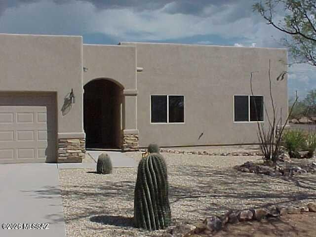Beautiful 3-bedroom, 2-bath Southwestern Territorial Modern home on a corner lot with mountain views in desirable Rio Rico, AZ. Open-concept living with abundant natural light, tile throughout, and spacious kitchen ideal for any family.  Private primary suite with en-suite bath and walk-in closet plus two versatile bedrooms. On over a quarter of an acre corner lot which offers added privacy and outdoor living potential. Enjoy serene desert surroundings and stunning Arizona sunsets?perfect blend of style, comfort, and location.