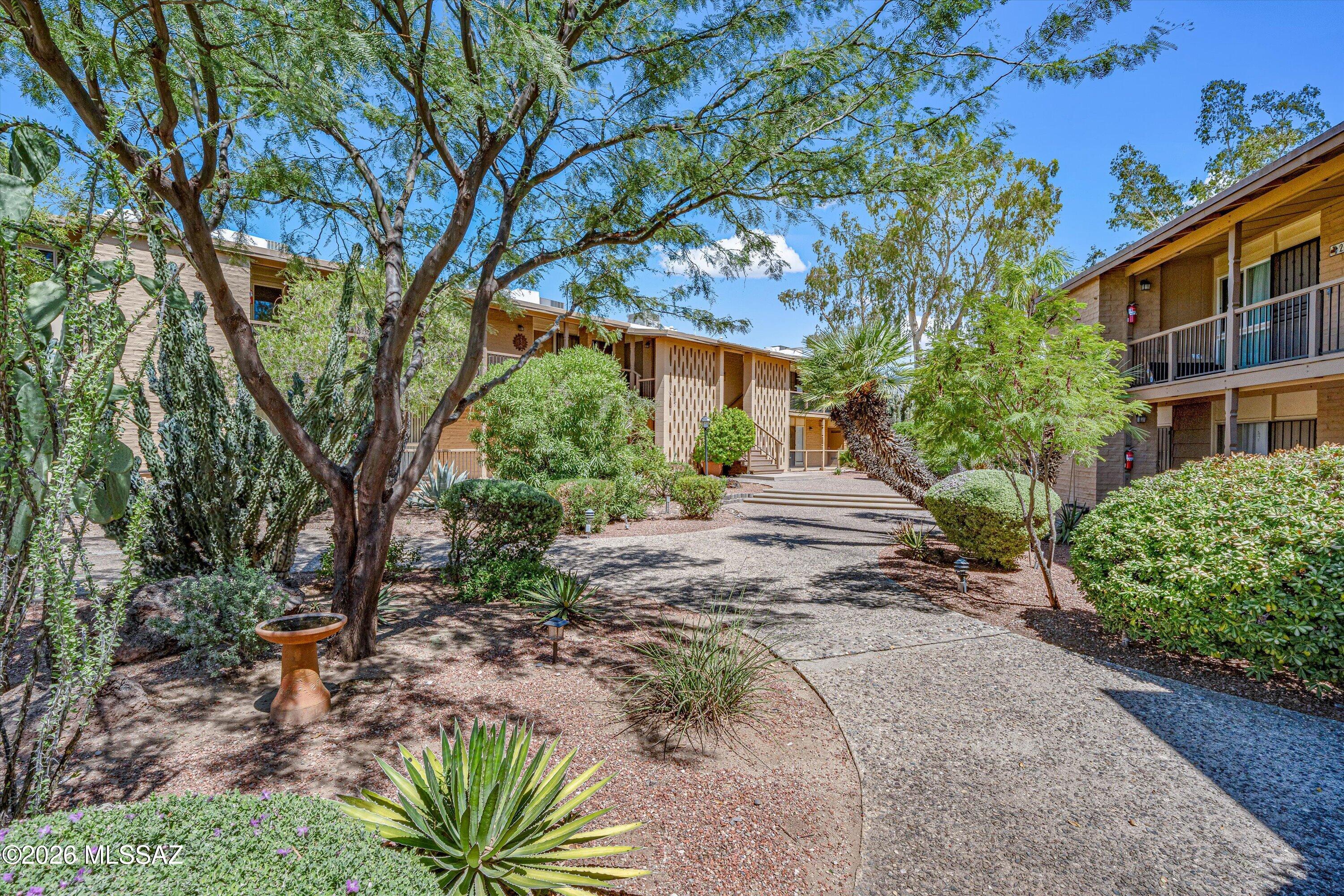 Charming mid-century condo located in Oro Valley's desirable Oro Valley Country Club community. This 2 BD/2 BA, 1,100 Sq.Ft. upstairs corner unit offers an inviting floorplan with a spacious family room, dining area and an abundance of natural light throughout. Large windows showcase beautiful Catalina Mountain views and create a bright, welcoming atmosphere. Recent updates include a NEW HVAC system in 2021 and NEW refrigerator in 2025. The well-maintained complex features a community pool, mature landscaping and amazing mountain views. Enjoy an ideal location close to shopping, restaurants, schools, The Loop bike path, hiking trails and more. HOA includes exterior maintenance and landscaping, pool, roof, sewer, garbage and water, making for easy, low-maintenance living in a fantastic..... .... Oro Valley location