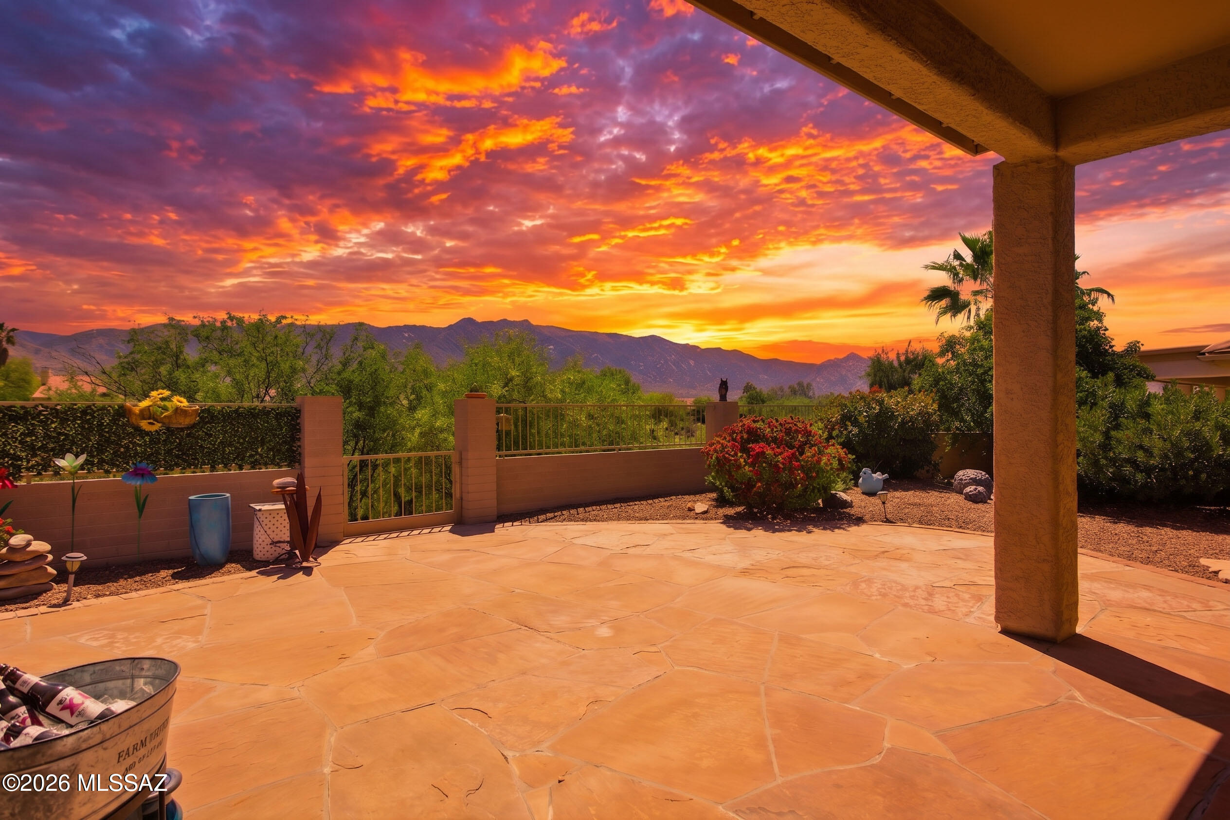 Wake up every morning to sunlight pouring in and breathtaking sunrises over the Catalina Mountains while you are enjoying your coffee.
This beautifully updated 2BR 2BA home features two en suites with ample space for an office area.
Soaring 15 foot cathedral ceilings and walls of windows throughout the main living areas create an open, airy atmosphere and fill the home with natural light.  Luxury vinyl plank flooring, all new SS appliances, New baseboards, two custom floor to ceiling stone showers, and two generous walk in closets are just a few of the features. Inviting secured iron screened in porch and enclosed backyard are welcoming to any pet. Updated fixtures, fans, faucets and hardware throughout add a fresh, modern touch.

Ideally located in a highly desirable HOA 1 area where