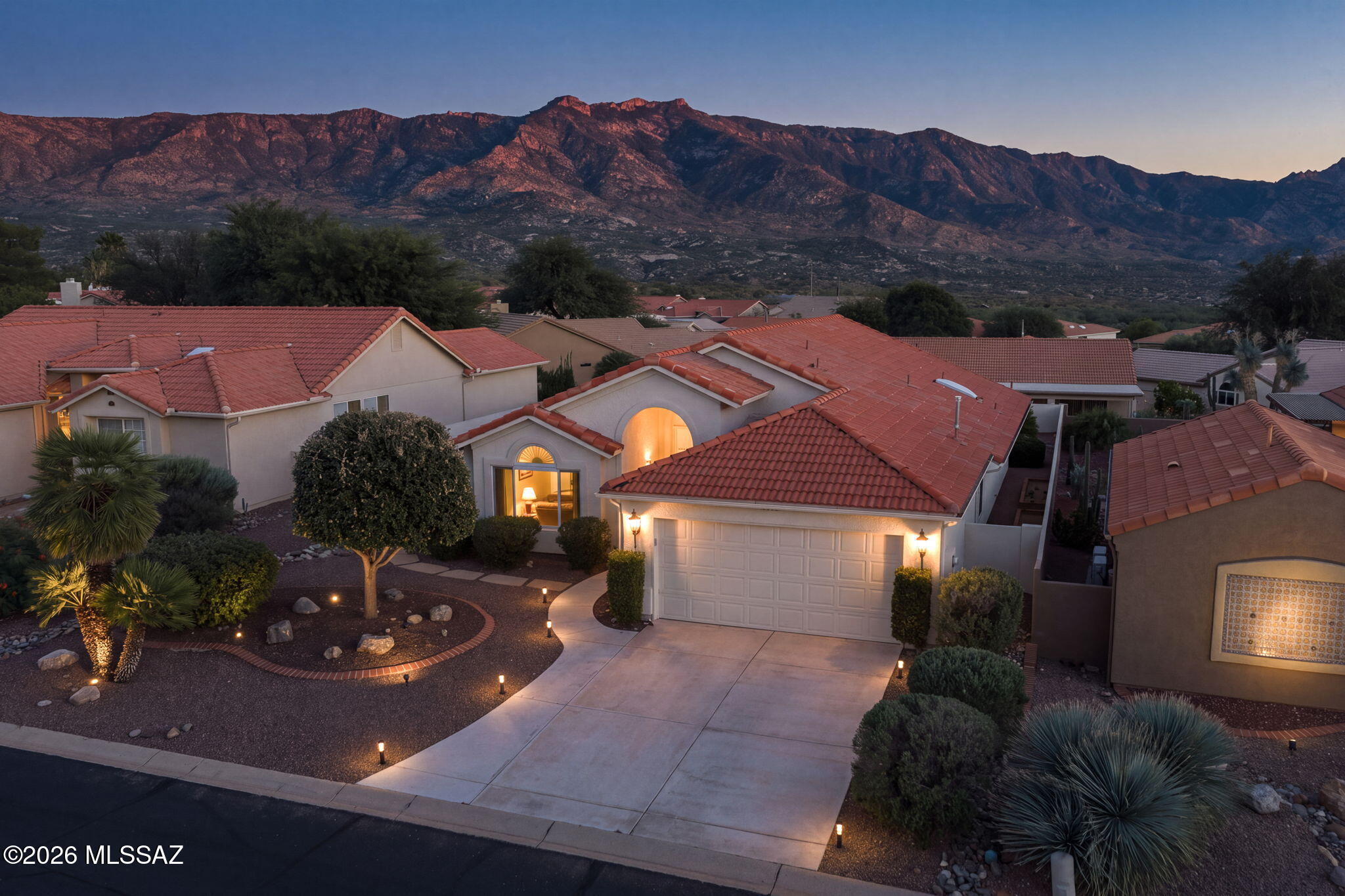Discover stunning mountain views in this totally renovated 2BD/2BA (1883sq ft) +New Roof, Windows, Carpet, and LVP Flooring. Additional LVP Flooring in LR, DR and GR to be completed this October. The well-equipped and totally renovated kitchen provides plenty of counter space, new cabinetry, new kitchen island, breakfast bar, and snack bar with beverage cooler area. New cabinetry throughout entire home. Pass through the entrance to discover a bright and airy open floor plan. New windows draw in an abundance of bright sunshine and mountain views. Spacious primary suite hosts spa like bathroom and walk in closet. The indoor common spaces transition smoothly outdoors onto a covered rear patio. Framed by scenic mountain views and low-maintenance desert plantings, the manageable, yet expansive lot serves as a peaceful enclave to take in panoramic, front-row views of the Catalina mountain ranges during sunrise or quiet evenings. Living on Round Robin Lane places an enviable active lifestyle right at your doorstep. Residents enjoy close proximity to SaddleBrooke's elite master-planned amenities, including championship golf courses, tennis and pickleball courts, resort-style swimming pools, putting greens, a modern fitness center, and vibrant social clubs.