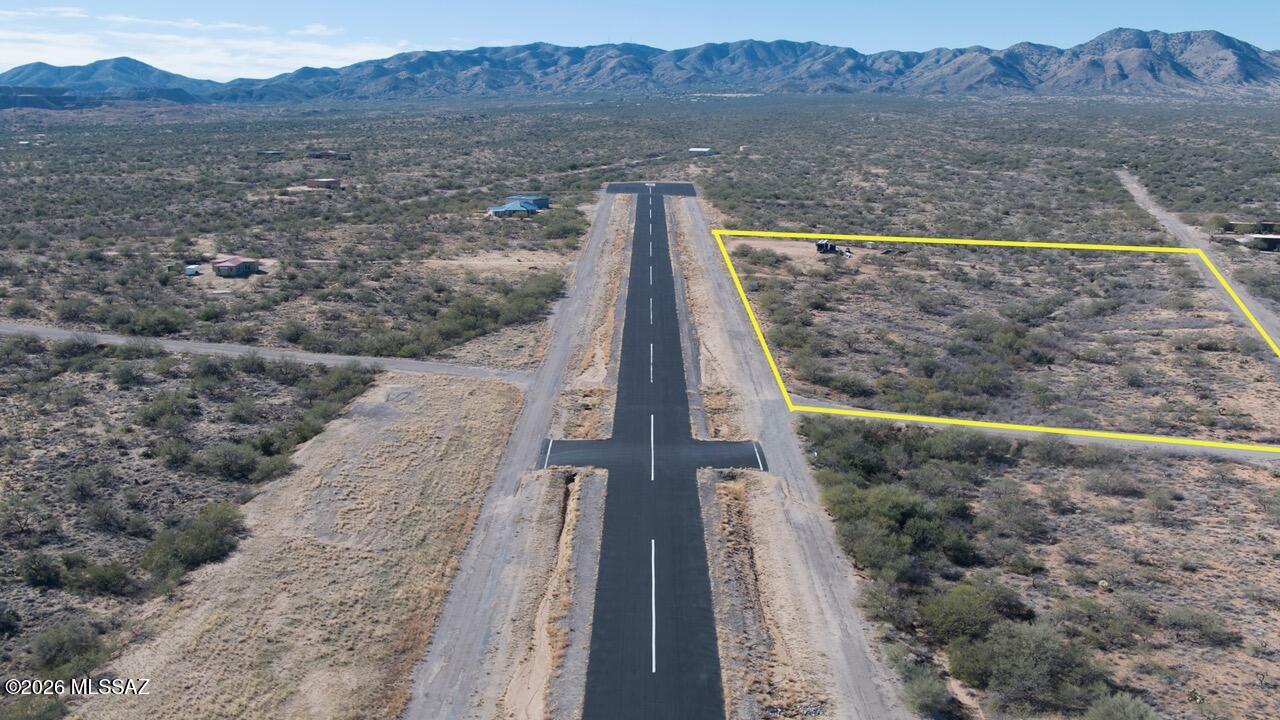 Build-ready Airpark Lot with Panoramic Views!  This stunning vacant lot is ready for your dream build and comes equipped with septic, water storage, and solar.  Located in a private airpark and conveniently near the runway, it's perfect for aviation lovers or anyone seeking a unique lifestyle.  Enjoy breathtaking views, privacy, and quick access to the city- all in one incredible property.