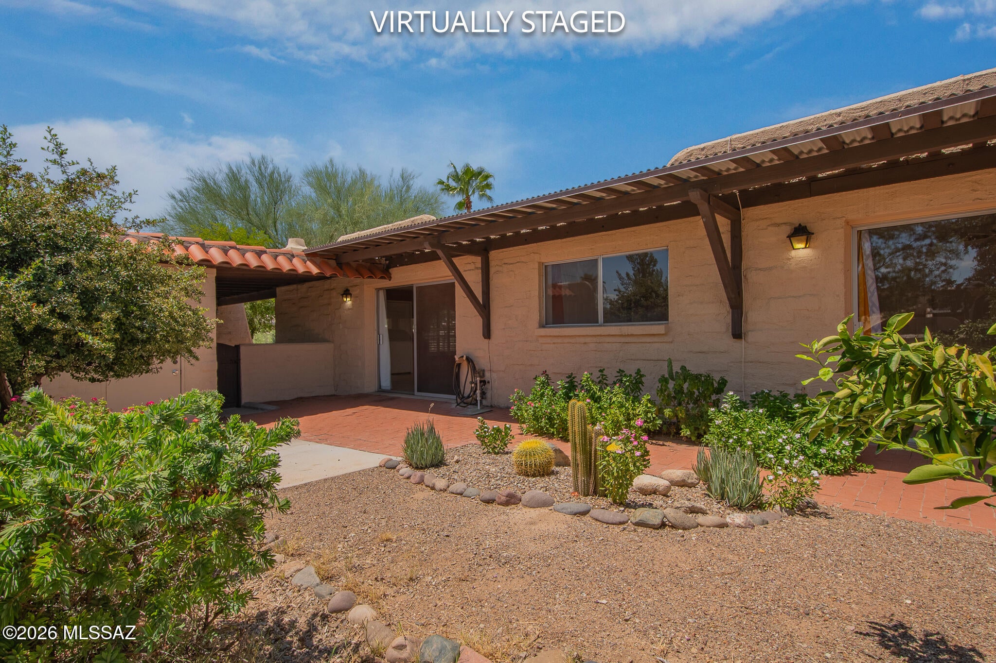 Move-in ready townhome featuring a modern kitchen with granite countertops, stainless steel appliances, and sleek contemporary cabinetry. The inviting great room boasts easy-care ceramic tile throughout and a cozy, classic beehive fireplace. Enjoy Arizona outdoor living year-round with a tree-shaded front courtyard, beautifully landscaped backyard, and a private workshop perfect for hobbies or extra storage. Community amenities include clubhouse and a refreshing pool/spa with stunning mountain views, all just minutes from top shopping and dining.