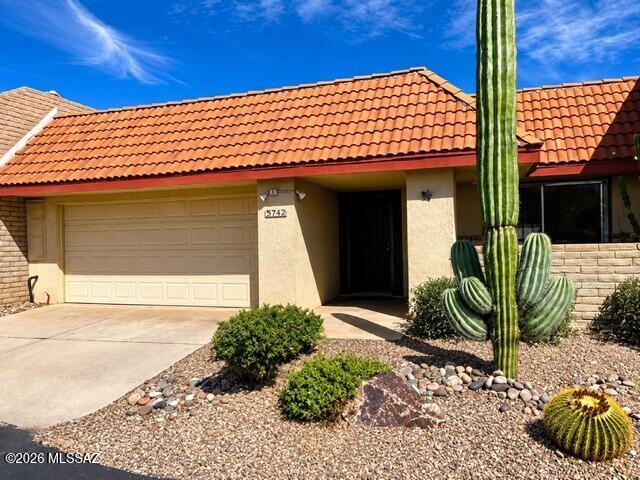 Spacious 1,678 sq. ft. Catalina Foothills townhome offering 2 bedrooms plus a versatile flex room. Inviting floor plan features generous living and dining areas, a distinctive fireplace, breakfast nook, bright kitchen, abundant storage and a 2-car garage. Enjoy a private, low-maintenance backyard with covered patio. Community amenities include two pools, spa, clubhouse, fitness center, library, playground, tennis, pickleball and basketball courts. Located in the Catalina Foothills School District and just minutes from La Encantada, restaurants, grocery stores, hiking and outdoor recreation.