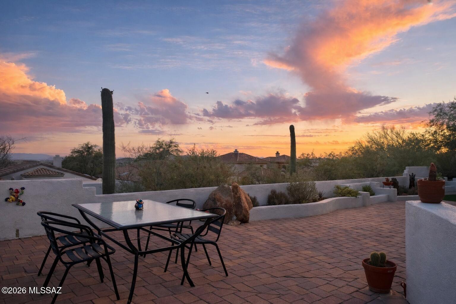 Perched on an elevated end lot on just under a qtr acre, this beautifully updated modern home offers sparkling city views, Tucson sunsets & sunrises w/ exceptional privacy! No neighbors behind or to one side. Designed for comfortable main-level living, nearly all living spaces are located downstairs, including the spacious primary suite. Upstairs features 1 bdrm w/ en suite ideal for guests, or flex space. Versatile 5th bdrm, soaring ceilings & expansive wall of windows fill the home w/ natural light. The chef's kitchen showcases warm gray quartz counters w/ dual waterfall edges & dedicated prep area. Beautiful agate printed tile/gas fireplace & automated patio screens for seamless outdoor/indoor living year round. Schedule your showing today!
Range price from 679K-700k 
Owner/agent