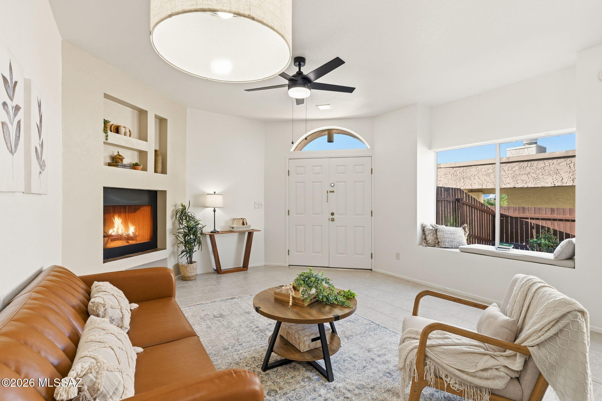 Located in the Lazy Creek subdivision in central Tucson, this contemporary single-level townhome offers a seamless blend of comfortable indoor living and private outdoor space. Built in 1982, the home features 1,128 square feet with 2 bedrooms and 2 bathrooms in a light-filled, open layout enhanced by abundant natural sunlight. Enjoy select mountain views from within the home and relax on the exceptionally private, north-facing covered patio--perfect for year-round outdoor living. The living room features a cozy wood-burning fireplace, creating a warm and inviting atmosphere. Recent updates include fresh interior paint, new carpet in the bedrooms and a newer HVAC system. The washer and dryer convey with the home for added convenience. Residents of Lazy Creek enjoy access to the community pool and nearby park, along with easy connectivity to The Loop, Tucson's renowned 131-mile path ideal for cycling, walking, and horseback riding. The home is also conveniently located near Tucson Medical Center, University of Arizona, and downtown Tucson. The property includes a two-car carport with potential for conversion to an enclosed garage, offering flexibility for future improvements. This townhome presents a wonderful opportunity to enjoy a low-maintenance lifestyle in one of Tucson's most convenient locations.
