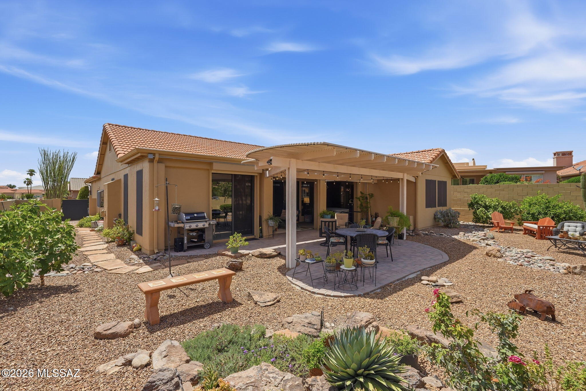 Beautifully updated turn key SaddleBrooke Paloma (Madera) designed with exceptional flow between the kitchen, living spaces, and outdoors. Catalina Mountain views can be enjoyed from the kitchen, family room, and the beautifully private backyard. Several patio sliders create a seamless connection for everyday living and entertaining. Light-filled interiors feature tile flooring throughout, vaulted ceilings, plantation shutters, and an extended family room with gas fireplace. The updated kitchen and baths bring a fresh, contemporary feel. The den/office, guest suite, 2.5-car garage with golf cart space, roof (2022) and HVAC (2022), and exterior paint (2025) complete this thoughtfully maintained home. Home is available turn key.
