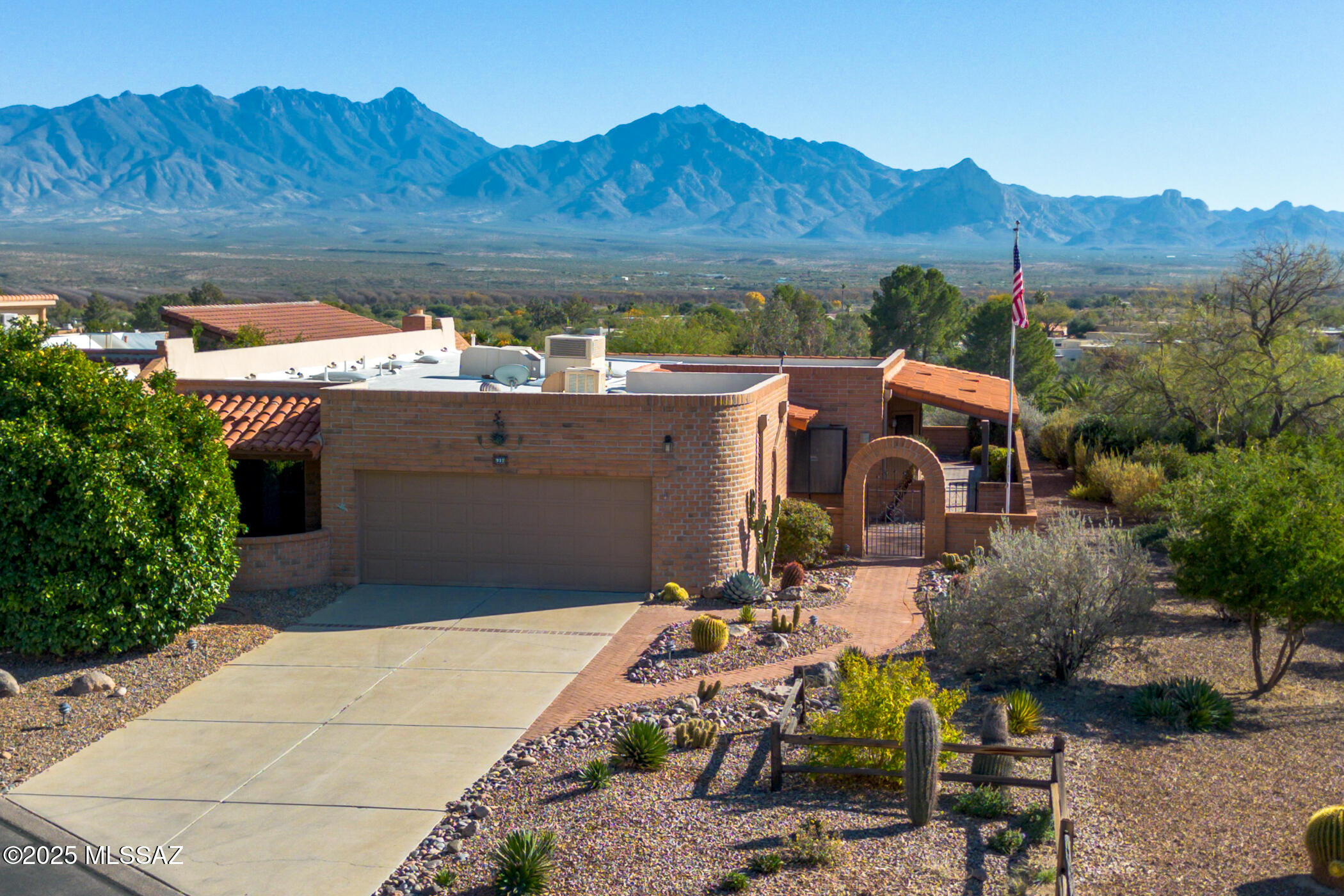 Welcome to 937 W Desert Hills Drive, where sweeping, unobstructed Santa Rita Mountain views, generous living space, and classic Green Valley charm come together in the desirable Desert Ridge neighborhood.
From the moment you arrive, this home feels welcoming. A mature grapefruit tree adds character to the front yard and the bonus of fresh citrus right outside your door. Step inside this spacious 2,050 sq ft slump block home and you'll find a light, comfortable interior that has been thoughtfully refreshed while maintaining the warmth that makes it feel like home. The flexible floor plan features 2 bedrooms, 2 bathrooms, and a versatile den that's ideal for a home office, hobby room, or additional guest space. Recent improvements include removed popcorn ceilings, fresh interior paint, new carpet, and a newly installed primary bathroom vanity. The kitchen has also been updated with refreshed cabinetry and countertops, while large windows bring in abundant natural light throughout the home. But the real showstopper is waiting outside. Step onto the expansive wraparound covered patio and take in the spectacular, unobstructed views of the Santa Rita Mountains. This is Arizona outdoor living at its best, with a peaceful setting for morning coffee, afternoon gatherings, sunset dinners, or simply sitting back and enjoying the mountain scenery. The home also offers important recent improvements, including an HVAC system and water heater completed in 2022 and a fresh roof coating in August 2026, adding extra peace of mind for the next owner. Located just minutes from Green Valley Recreation centers, golf courses, walking paths, shopping, restaurants, and everyday conveniences, this home puts the Green Valley lifestyle within easy reach. Mountain views like these are what people come to Green Valley for and opportunities to enjoy them from your own backyard don't come along every day. Come experience 937 W Desert Hills Drive for yourself.