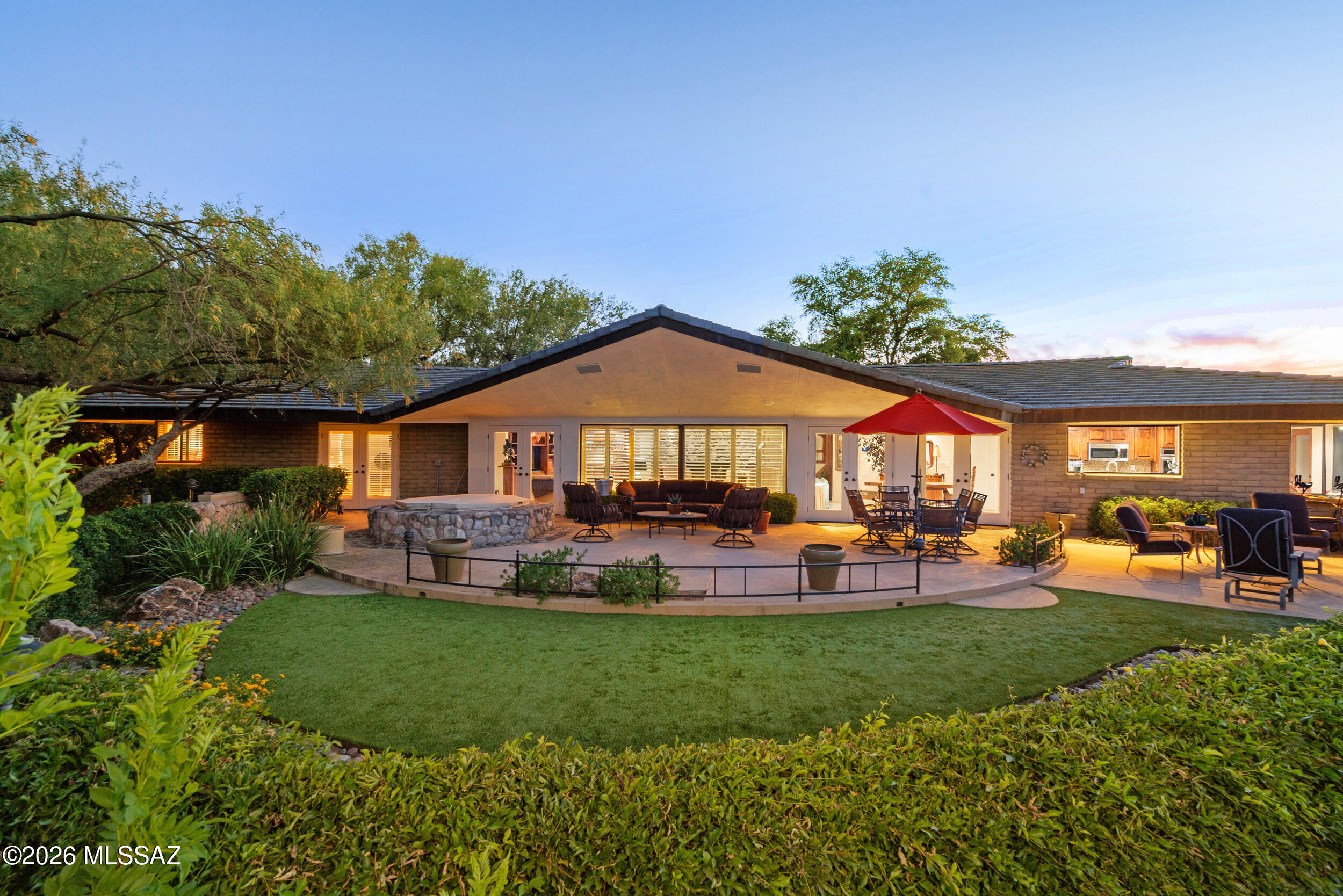 Located in the highly desirable Oro Valley Country Club, this stunning 3-bedroom, 3-bathroom home offers breathtaking golf course and mountain views on a spacious lot. Designed for comfort and entertaining, the home features a large great room with a striking fireplace and built-in entertainment center. The kitchen showcases granite countertops and a charming bay window that fills the space with natural light. The expansive primary suite includes a large ensuite bathroom and walk-in closet. Additional highlights include a built-in wet bar, generous living spaces, seamless indoor-outdoor living, and tranquil surroundings. Sellers are motivated! This is the perfect home for those seeking elegance, space, and spectacular views in one of Oro Valley's most sought-after communities.