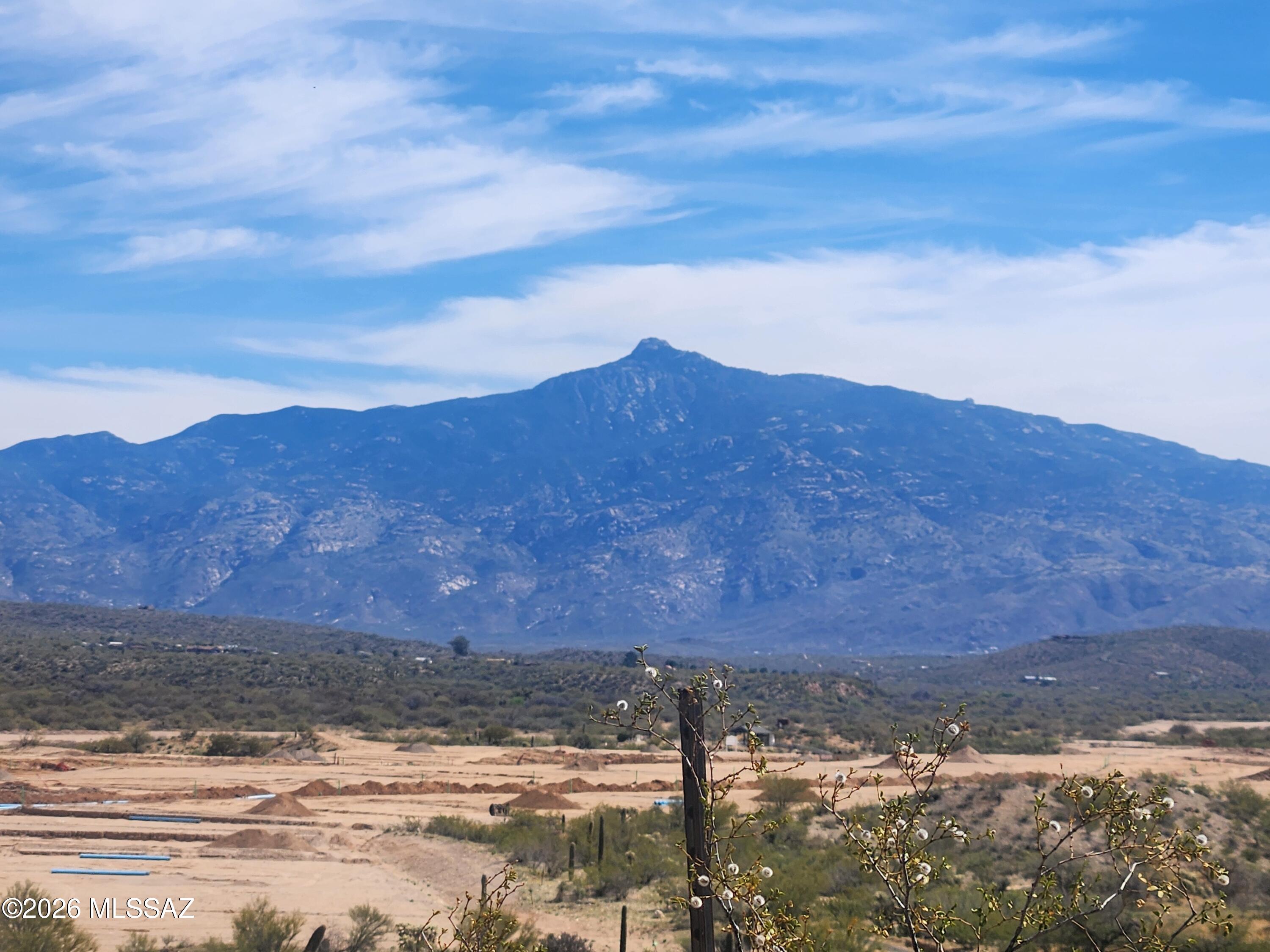 Incredible opportunity to own a premier homesite in the desirable Rocking K Ranch Estates! This exceptional  lot offers panoramic vistas and breathtaking mountain views that stretch for miles creating the perfect backdrop for your custom dream home. The buildable homesite is ideally positioned to maximize privacy while preserving the surrounding natural beauty and desert landscape. With electric and water available, the property offers a straightforward path to development while still allowing you to design and build exactly what you envision. Whether you're looking to build now or secure land for the future, this presents an opportunity to create your own private retreat surrounded by spectacular mountain views and natural beauty. Located in the award winning Vail School District, this property combines peaceful rural living with access to highly regarded schools. Residents of Rocking K Ranch Estates enjoy wide open spaces, stunning Arizona sunsets, and the tranquility of the Sonoran Desert, all while remaining within easy reach of nearby shopping, dining, and everyday conveniences.