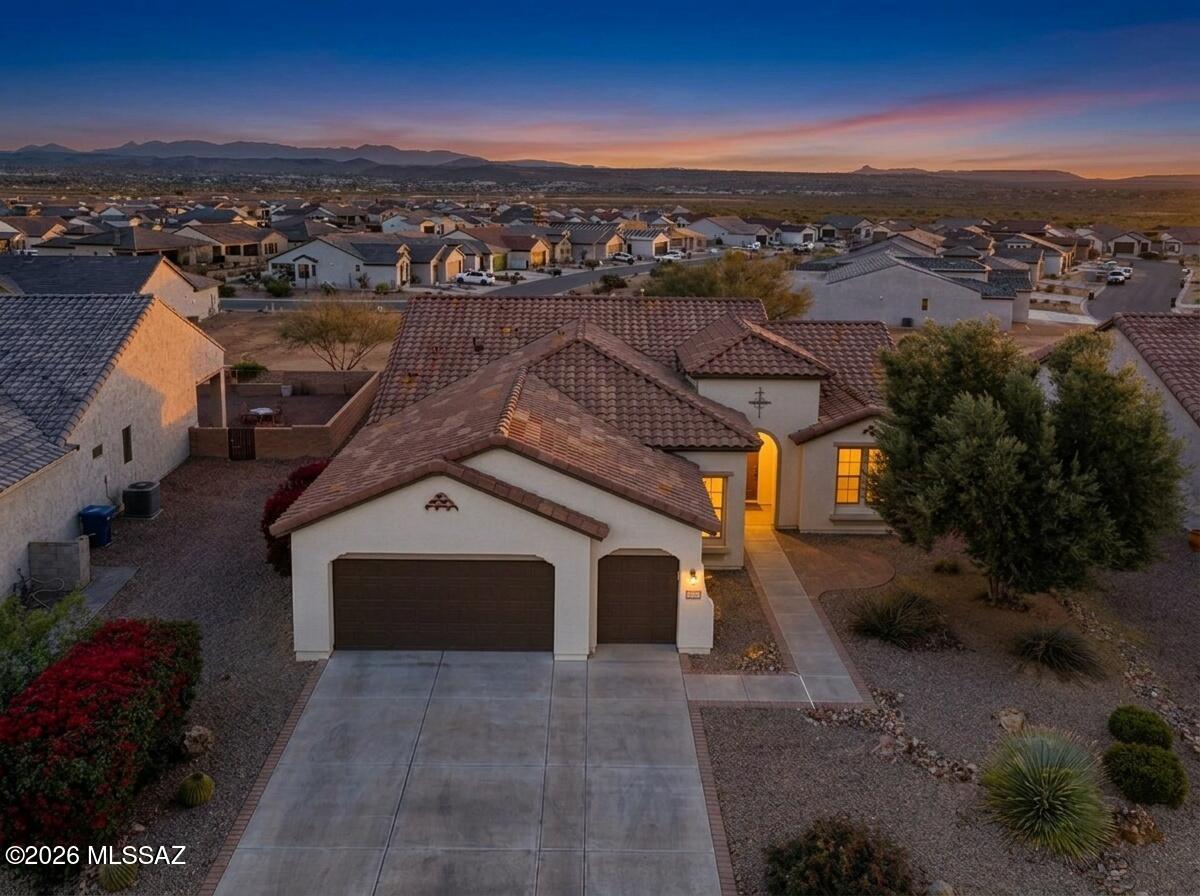 Refreshed & ready for the new owners!  Look at this 2012 extended Medina model, elevated lot w/ mountain views!  Spacious & stylish w/ coffered ceiling, a bank of windows w/ 12' wall of sliding doors w/ center opening.  20'' floor tiles, 4ft garage extension w/ golf cart garage.  The owners suite has a bay window extension, granite counters at the double sink, soaking tub & large shower. The kitchen has upgraded cherry cabinets w/ wide crown molding, under cabinet task lighting, slab granite, pull out shelves, planning desk and center island.  The GE appliance package includes the gas cooktop.  2 full bathrooms & a powder bath for company, den or office and an inviting entry!  A great place to call home!  New exterior paint 2026, new 1/2 re-roof on the front 2025, new faucets 2026!