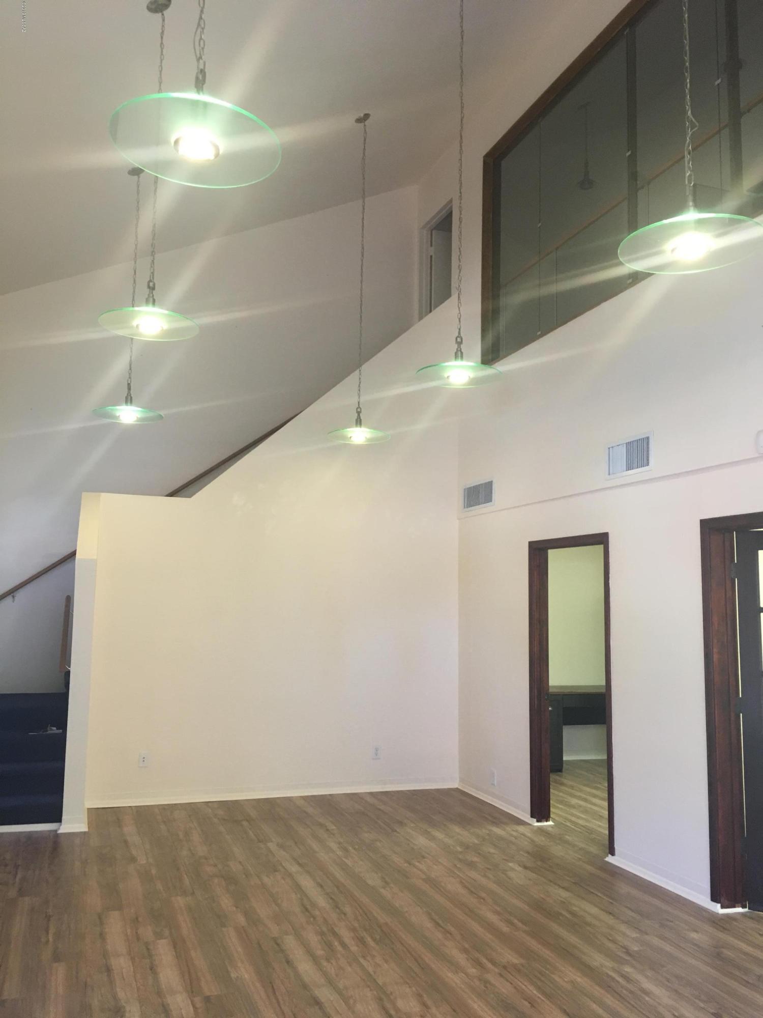 Office plus loft! Beautiful office for lease near U of A, UMC, convenient to downtown. Large open space plus 2 private offices, restroom, and upstairs loft. Neutral colors and wide plank wood laminate flooring.
