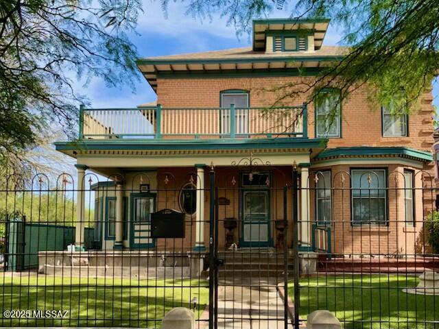 Historic Queen Anne Victorian home in the heart of Tucson with THREE additional rental units (2 bed, 1 bed, and studio) in the rear. Off-street parking included. The main house features 4 bedrooms, 3 bathrooms, coffered ceilings, wainscoting, custom trim, and original wood floors. The kitchen is updated with stainless appliances, granite countertops, a butcher block island, and a tiled backsplash. The primary suite includes a walk-in closet and private exit to a wrap-around deck with spiral stairs. Many upgrades throughout—new HVAC, Nest thermostats, smart locks, lighting, and more