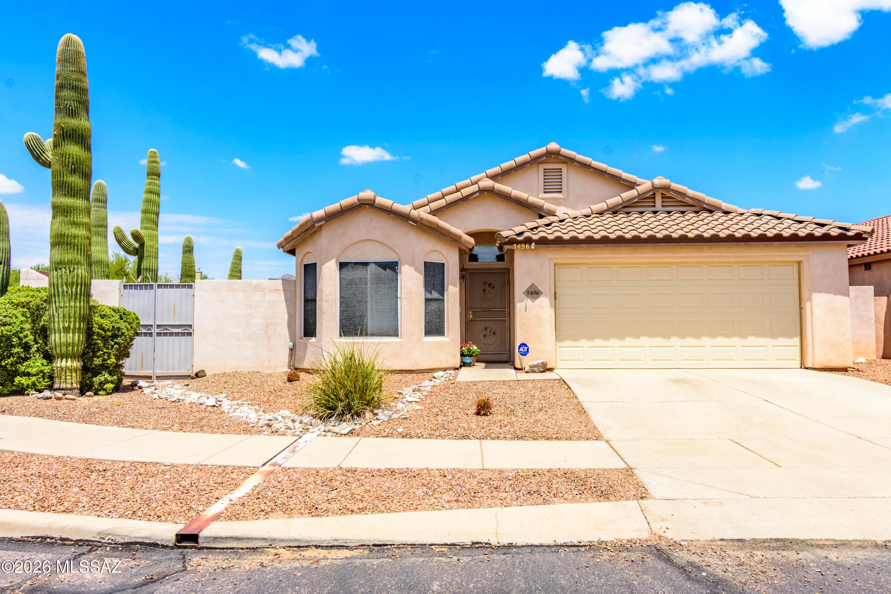 Welcome to luxury living in the highly sought-after Dove Mountain community. Perfectly positioned on one of the largest homesites in the neighborhood, this beautifully updated home offers a NEW ROOF, AC, flooring and more. Upon entry, your greeted with an open great room that connects the living, dining, and kitchen areas. The split-bedroom floor plan adds privacy, with generously sized bedrooms. Exceptional homes on lots of this size are rare to find. Don't miss the opportunity to make this remarkable property your own.