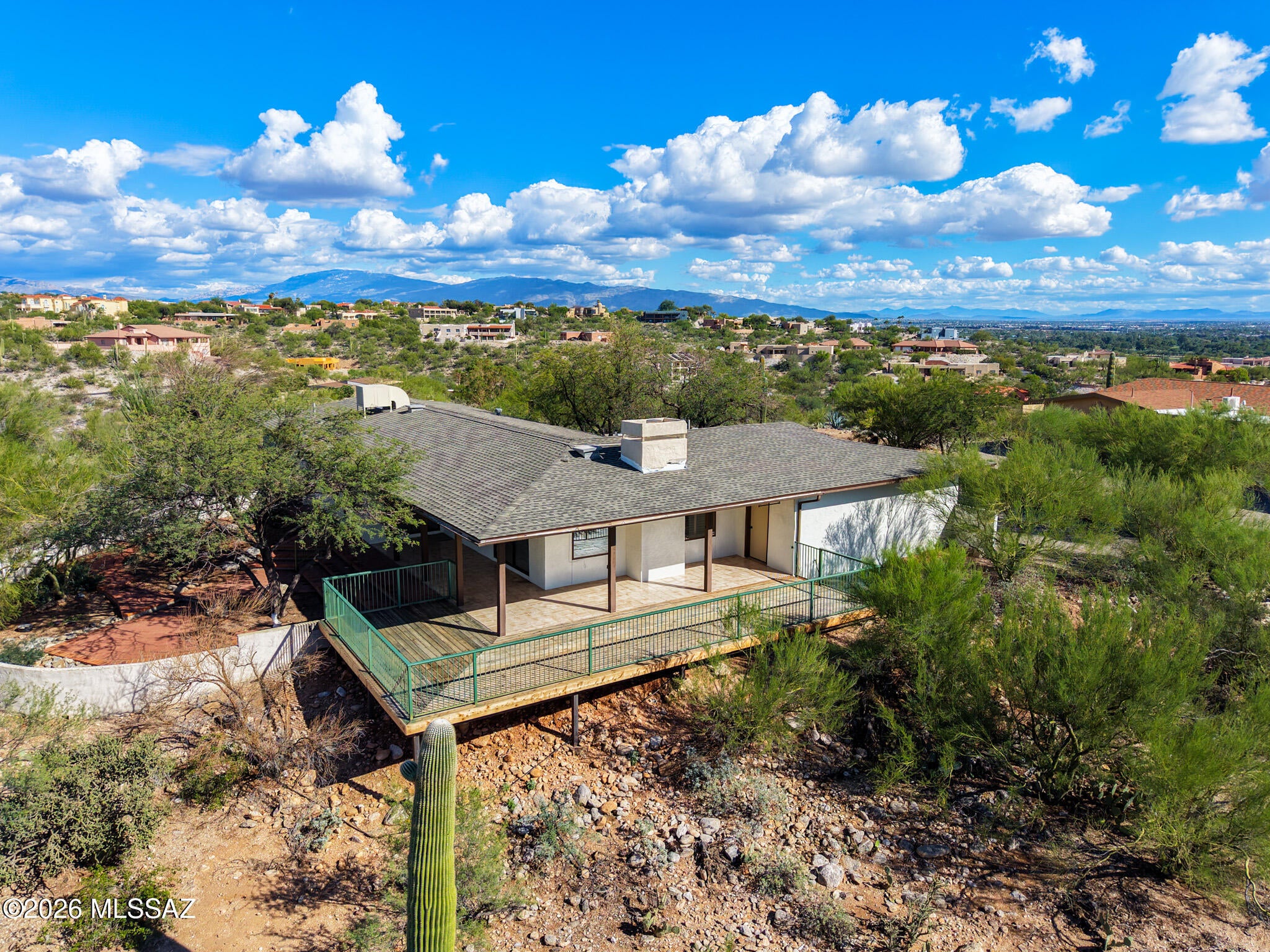 This is Tucson living at its best. Perched in La Buena Vida Estates, this beautifully refreshed single-story home delivers spectacular Catalina Mountain, city, sunrise and sunset views that take center stage from the moment you walk in. Expansive windows frame the scenery from multiple rooms, filling the 2,159 sq ft interior with natural light and bringing the surrounding desert landscape into the home.
Recently refreshed with a long list of improvements, the home features a new roof, freshly painted interior, popcorn ceiling removal, new baseboards, recessed lighting, new electrical outlets and switches throughout, and updated antique-black door hardware. Stained concrete flooring extends through the main living areas, with new carpet in the bedroom, while the kitchen has been updated with new stainless steel Frigidaire Gallery appliances.
The kitchen also features granite countertops and a breakfast bar, seamlessly connecting to both formal and casual dining spaces. Living areas include a family room with a gas fireplace and a separate living room, offering plenty of space for entertaining or quiet relaxation. Skylights and expansive windows enhance the abundant natural light throughout.
The spacious primary suite offers a private retreat with double vanities and a large walk-in shower. Two additional bedrooms and a separate hall bath with a shower provide flexibility for guests, a home office or additional living space.
Step outside and the setting becomes even more impressive. The redone deck and grand covered patio provide a front-row seat to panoramic Catalina Mountain views, sparkling city lights and Tucson's unforgettable sunsets. The surrounding desert landscape keeps the focus on the scenery and offers a low-maintenance approach to outdoor living, with frequent glimpses of local wildlife including javelina, hummingbirds and hawks.
Additional features include a two-car garage with built-in cabinets and workshop space, paved driveway, interior laundry, plantation shutters and masonry fencing.
With substantial recent improvements, an exceptional Catalina Foothills setting and views that are truly difficult to replicate, this is a home that needs to be experienced in person. Schedule your private showing today.