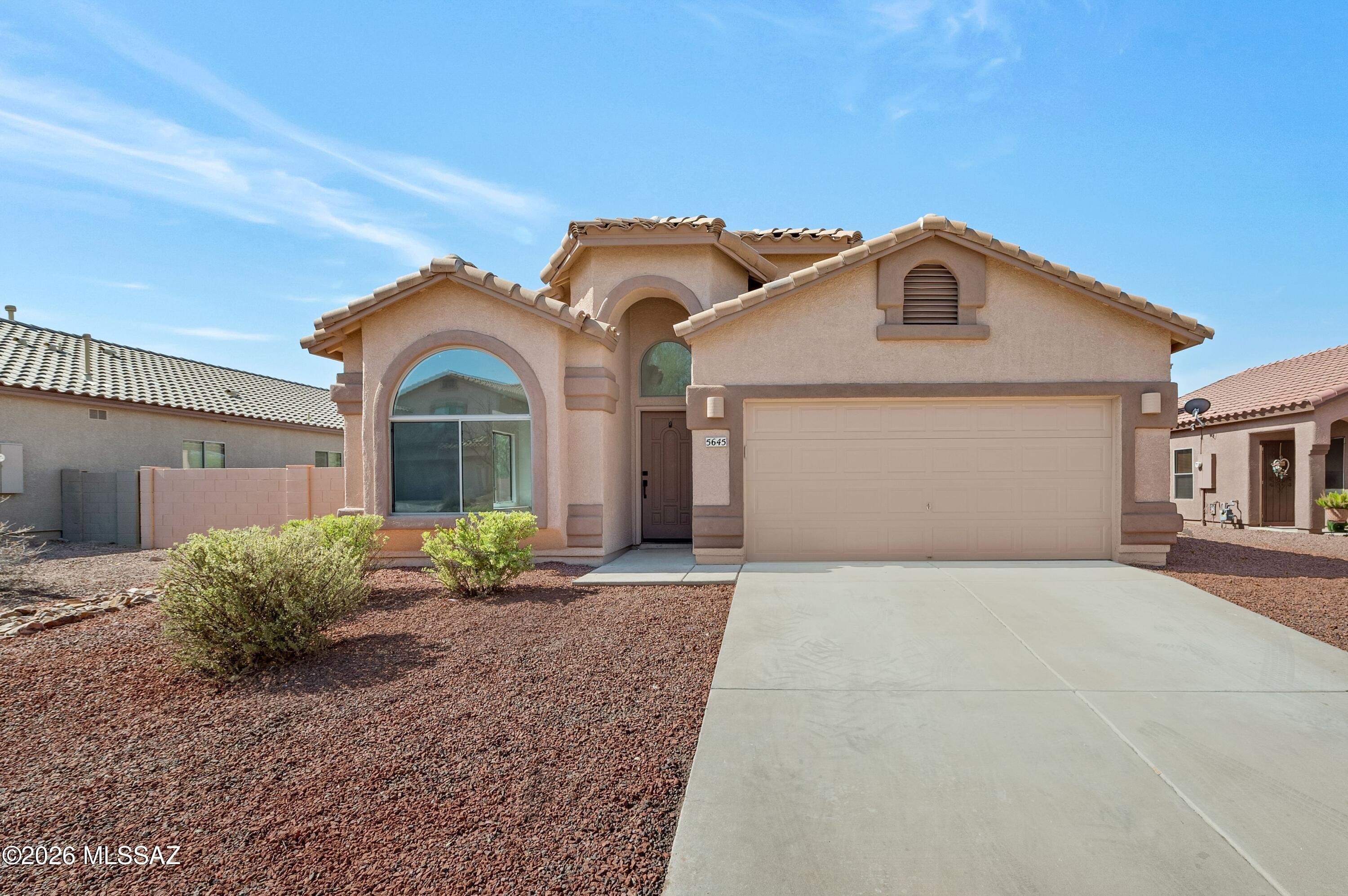MOVE-IN READY and located in a highly desirable community. Beautifully updated 4-bed home offers the perfect blend of comfort and style. Soaring vaulted ceilings, wood-look flooring, contemporary lighting, and a bright, open floor plan create a warm and inviting atmosphere. The remodeled kitchen is a standout feature, showcasing white shaker cabinetry, quartz countertops, and sleek modern finishes. The spacious primary suite provides a relaxing retreat with dual vanities and a walk-in closet. Three additional bedrooms offer flexibility for family, guests, or a home office. Situated in the rapidly growing Marana area, you'll enjoy easy access to shopping, dining, parks, schools, and everyday conveniences. This beautifully updated home is truly move-in ready and waiting for its next owner.
