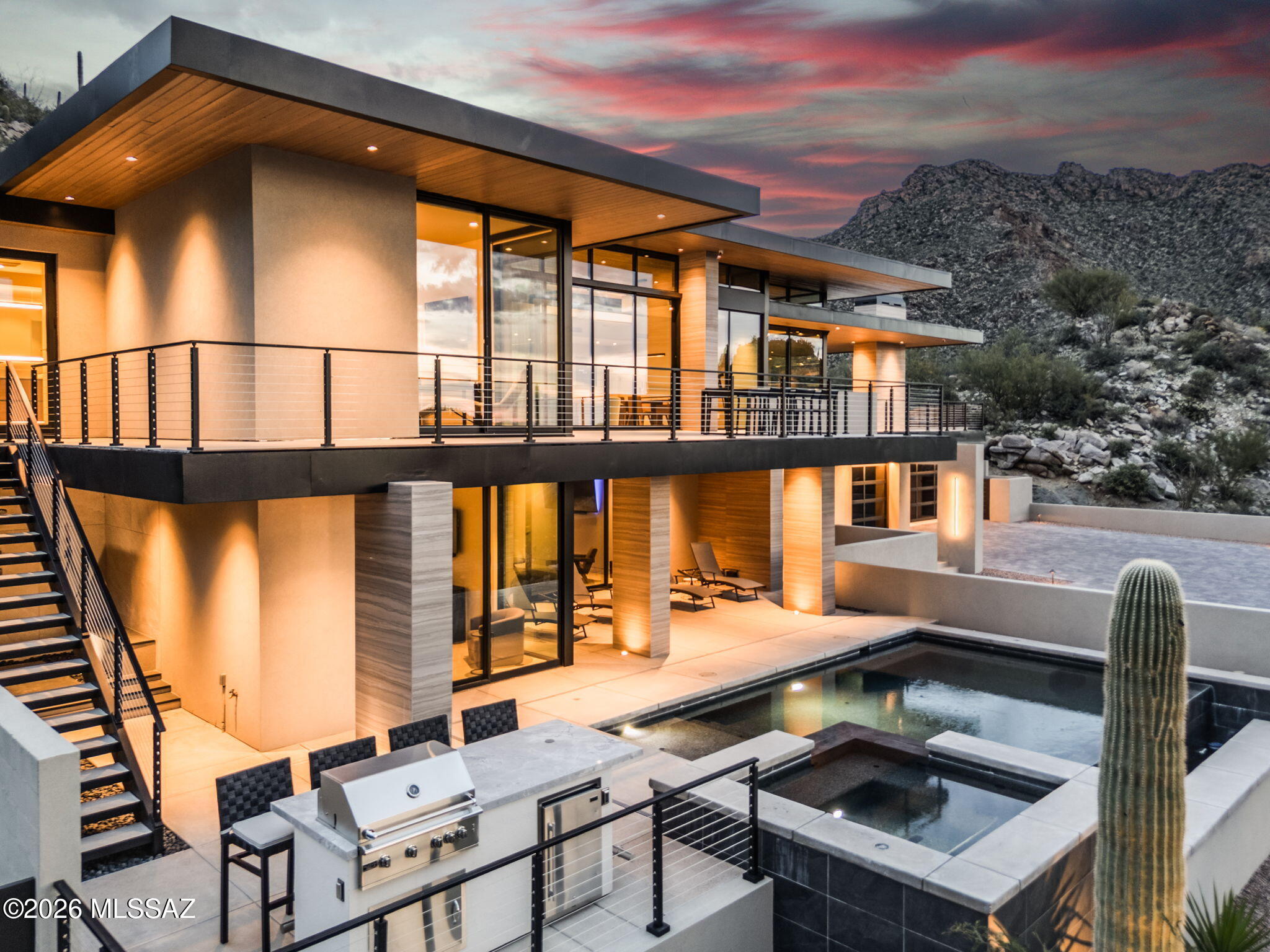 Experience the pinnacle of luxury living in this brand-new masterpiece, nestled within the prestigious Canyon Pass at Dove Mountain. Crafted in 2024 by renowned architect Kevin Howard, this stunning estate redefines elegance with its unparalleled design, breathtaking views, and exquisite attention to detail. From the moment you arrive, you'll be captivated by the home's striking architecture and meticulous landscaping. Inside, discover a sanctuary of sophisticated comfort, where every element has been carefully considered for a lifestyle of effortless indulgence. Enjoy the peace of mind and modern amenities of a freshly built home, crafted with the highest quality materials and construction standards. A chef's dream come true, the gourmet kitchen is equipped with top-of-the-line appliances, a large center island, and ample counter space for culinary creations. Immerse yourself in the breathtaking beauty of the surrounding mountains and desert landscape, offering unparalleled serenity and privacy. Relax and rejuvenate in your private oasis, featuring a sparkling infinity-edge pool that seamlessly blends with the horizon. Experience ultimate convenience and accessibility with a private elevator, providing effortless access to all levels of the home. This exceptional property offers a rare opportunity to own a truly remarkable home in one of Tucson's most coveted locations.