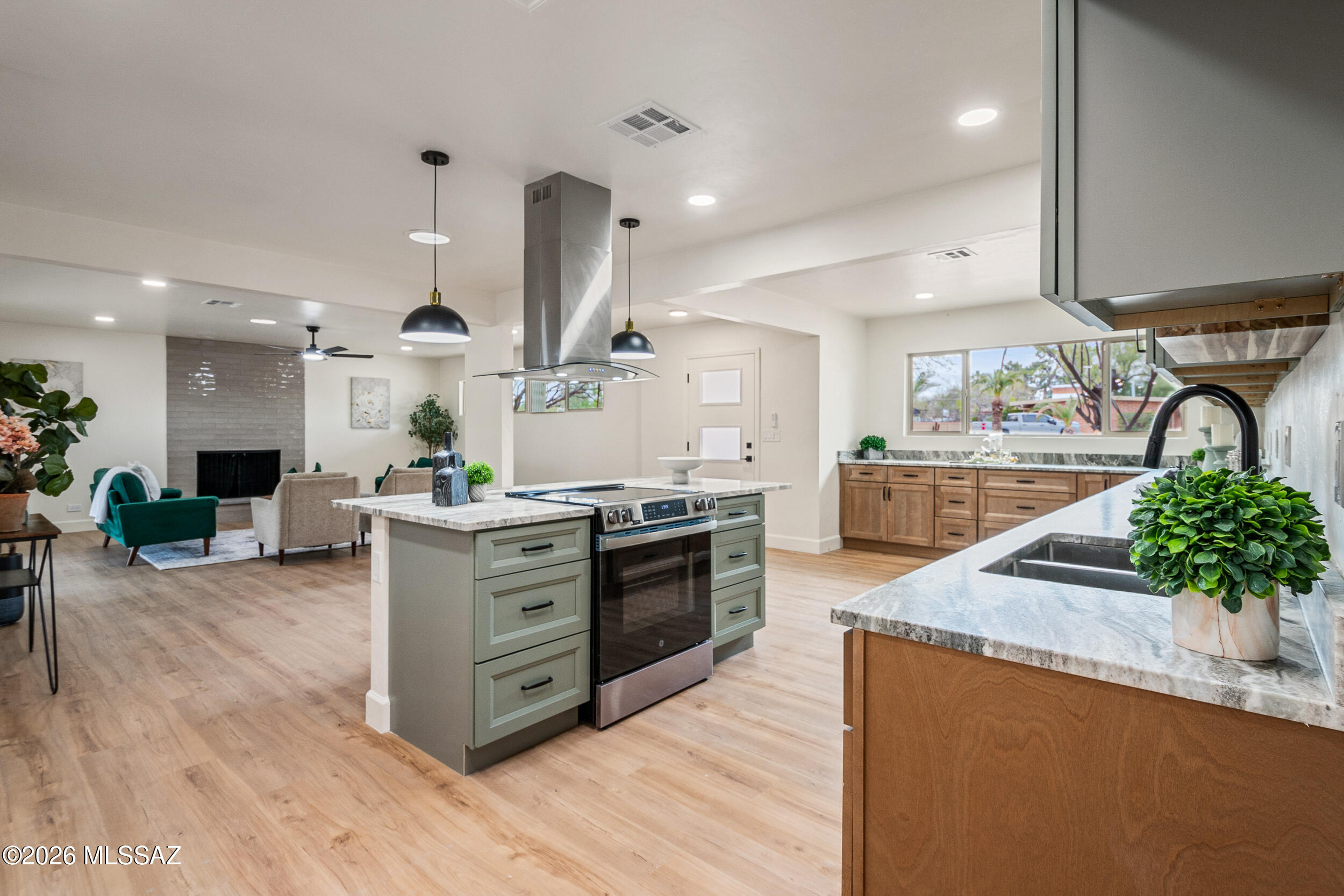 Homes rarely come available in this coveted neighborhood, and finding one fully renovated to this level is almost unheard of. This residence has been thoughtfully reimagined from top to bottom, delivering a seamless blend of modern polish and everyday comfort. The kitchen shines with sleek cabinetry, granite countertops, stainless steel appliances, updated fixtures, and statement lighting--an inviting hub for gathering and entertaining. Interiors feel fresh and refined with new paint, doors, trim, luxury vinyl flooring, plush carpet, upgraded lighting, and dual-pane windows throughout. Every bathroom has been completely transformed with new vanities, granite counters, modern fixtures, designer lighting, and spa-inspired showers. A private guest quarters offers flexible space for visitors, multigenerational living, or a secluded home office. Major system upgrades include a new electric HVAC unit and gas water heater. Outside, fresh exterior paint and low-care landscaping complete this turnkey offering. A rare opportunity where availability is scarce and quality is unmistakable.
