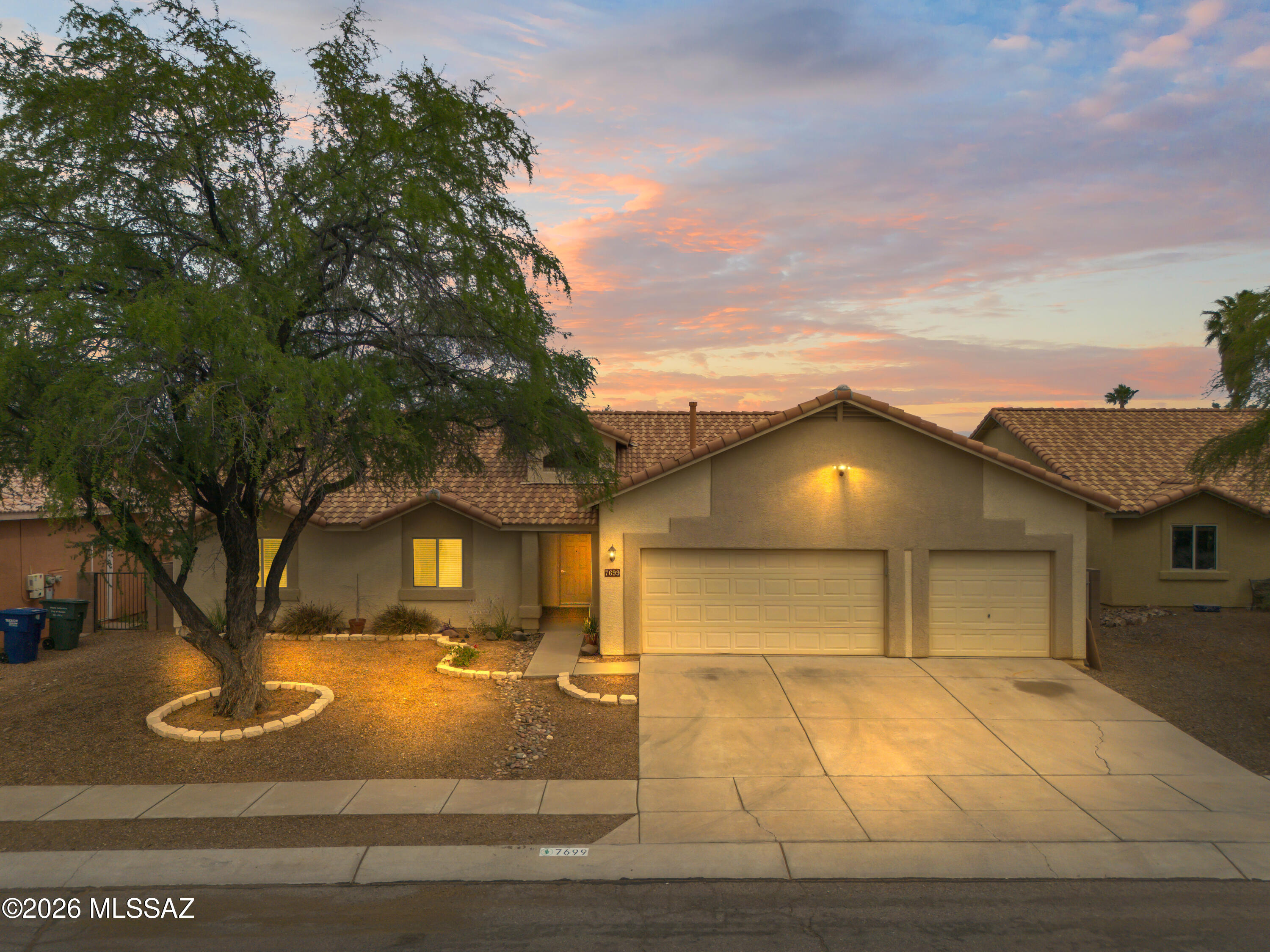 Well-maintained 4-bedroom, 2-bath home in desirable Rita Ranch! Features an open floor plan with a spacious family room off the kitchen, granite countertops, and ample cabinet space. Includes separate formal living and dining areas. Enjoy a large, private backyard with an expansive patio and sparkling fenced pool--perfect for entertaining. 3-car garage with shelving and attic access. Conveniently located near shopping, parks, and schools. Move-in ready!