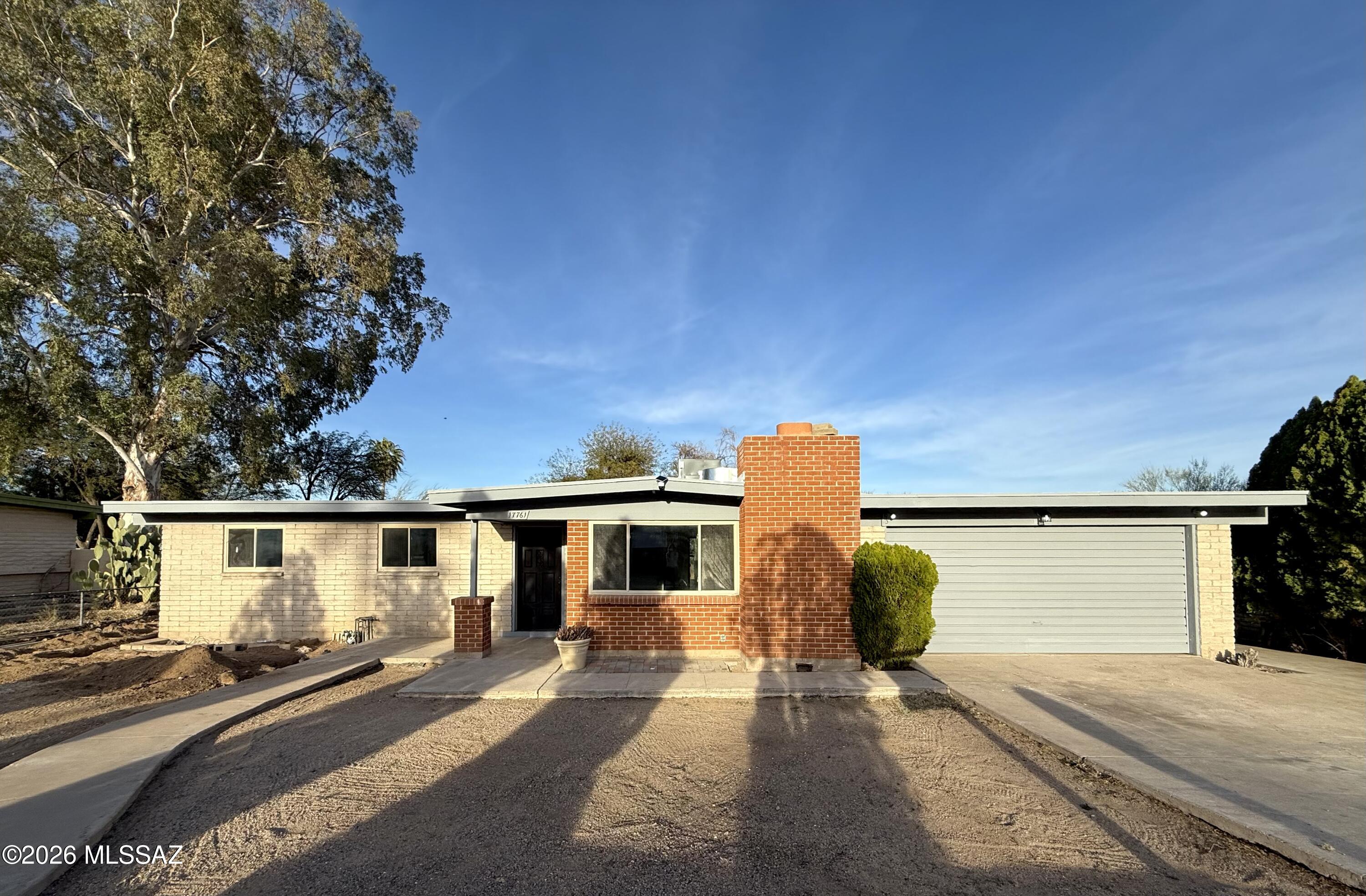 Welcome to this beautifully updated home in a sought-after neighborhood. Thoughtfully remodeled throughout, it is truly move-in ready. The bright kitchen features new quartz countertops and brand new cabinetry. An open layout showcases stylish vinyl flooring, a spacious living area, and a light filled dining space. The home offers four generously sized bedrooms and three tastefully renovated bathrooms with modern finishes. The two car garage includes a workshop area for added versatility. The ample backyard provides a private, secure setting for relaxing or entertaining. Schedule your showing today!