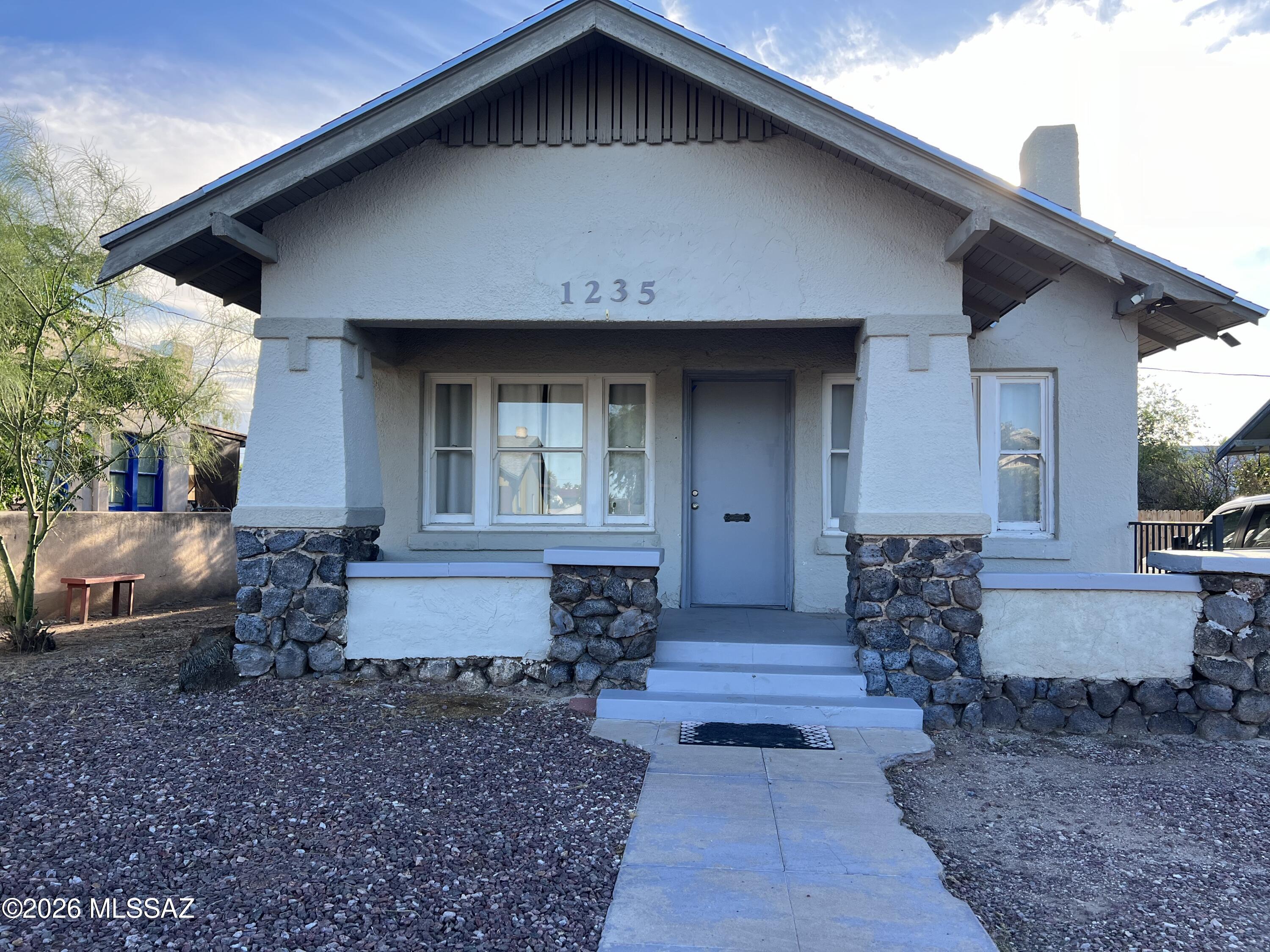 Charming cottage style home in Historic Feldman's Add, just 0.08 miles from the University of Arizona.This 3 bedroom 1 bath residence offers approximately 1,100 sqft of living space & blends historic character with modern updates.Features include refinished hardwood floors, updated countertops & cabinetry, newer appliances that are included & remodeled bathroom.The flexible floor plan includes a private lower level bedroom ideal for guests,a home office or additional living space.Located in one of Tucson's most desirable historic neighborhoods with easy access to campus, downtown, dining & entertainment.Excellent opportunity for homeowners, students, faculty or investors seeking a prime location with strong rental potential.Furniture can be included!Schedule a showing today!